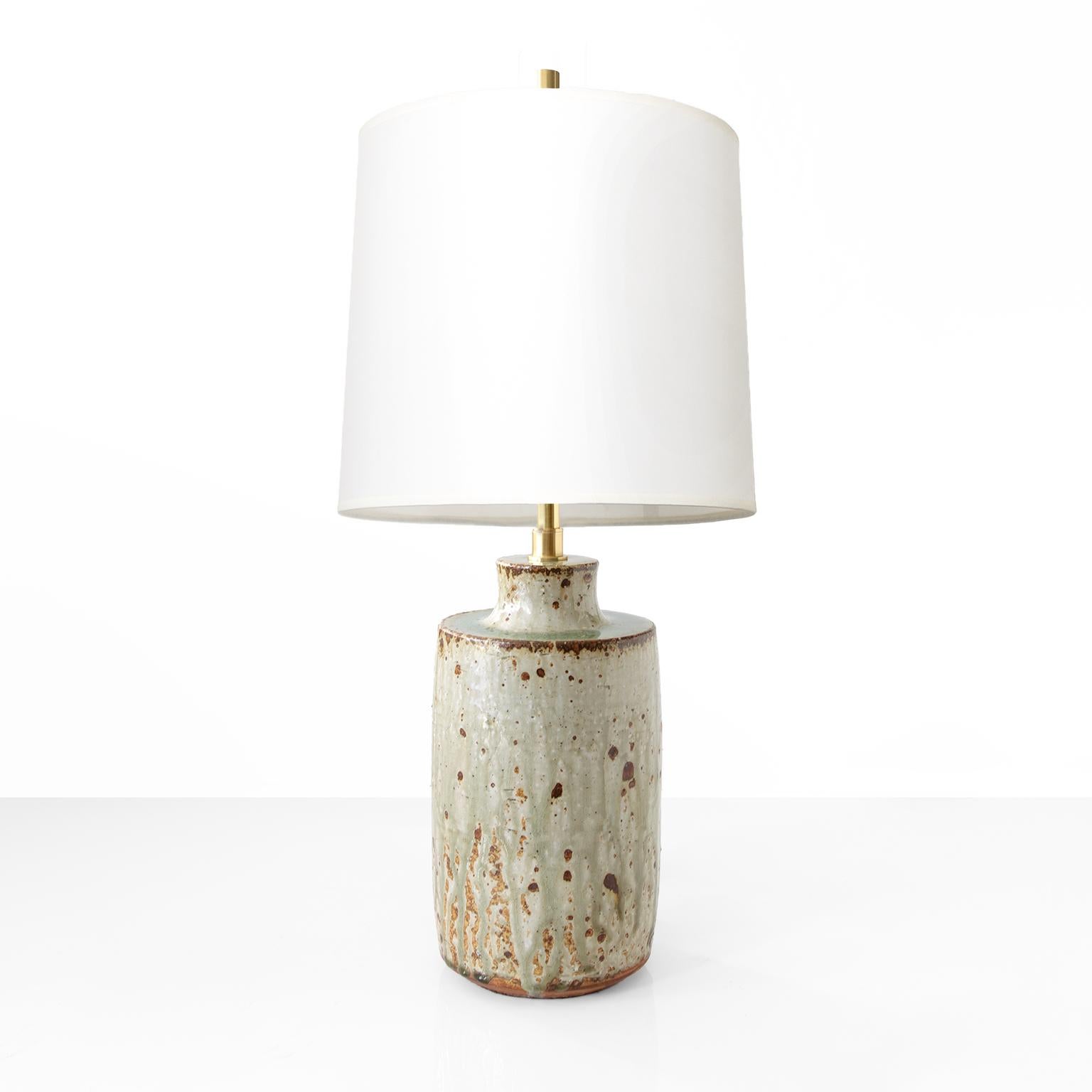 A large glazed stoneware lamp base designed and hand made by Marianne Westman for Rorstrand Atelje, signed on bottom.. Newly restored with polished and lacquered brass stem and a double socket cluster. Ready for use in the USA. Complete with a silk