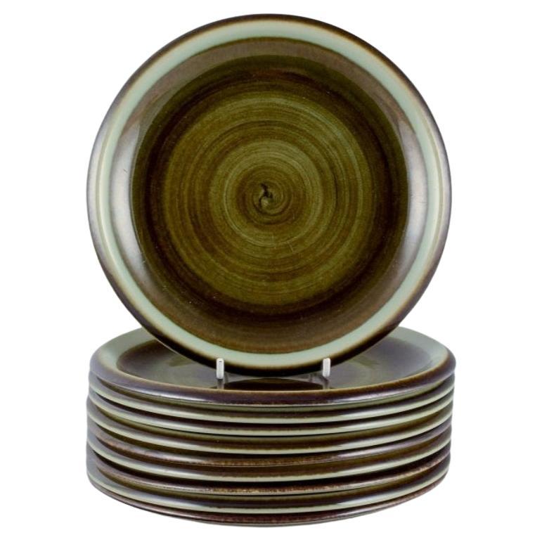 Marianne Westman for Rörstrand. "Maya", set of ten plates with green-toned glaze For Sale