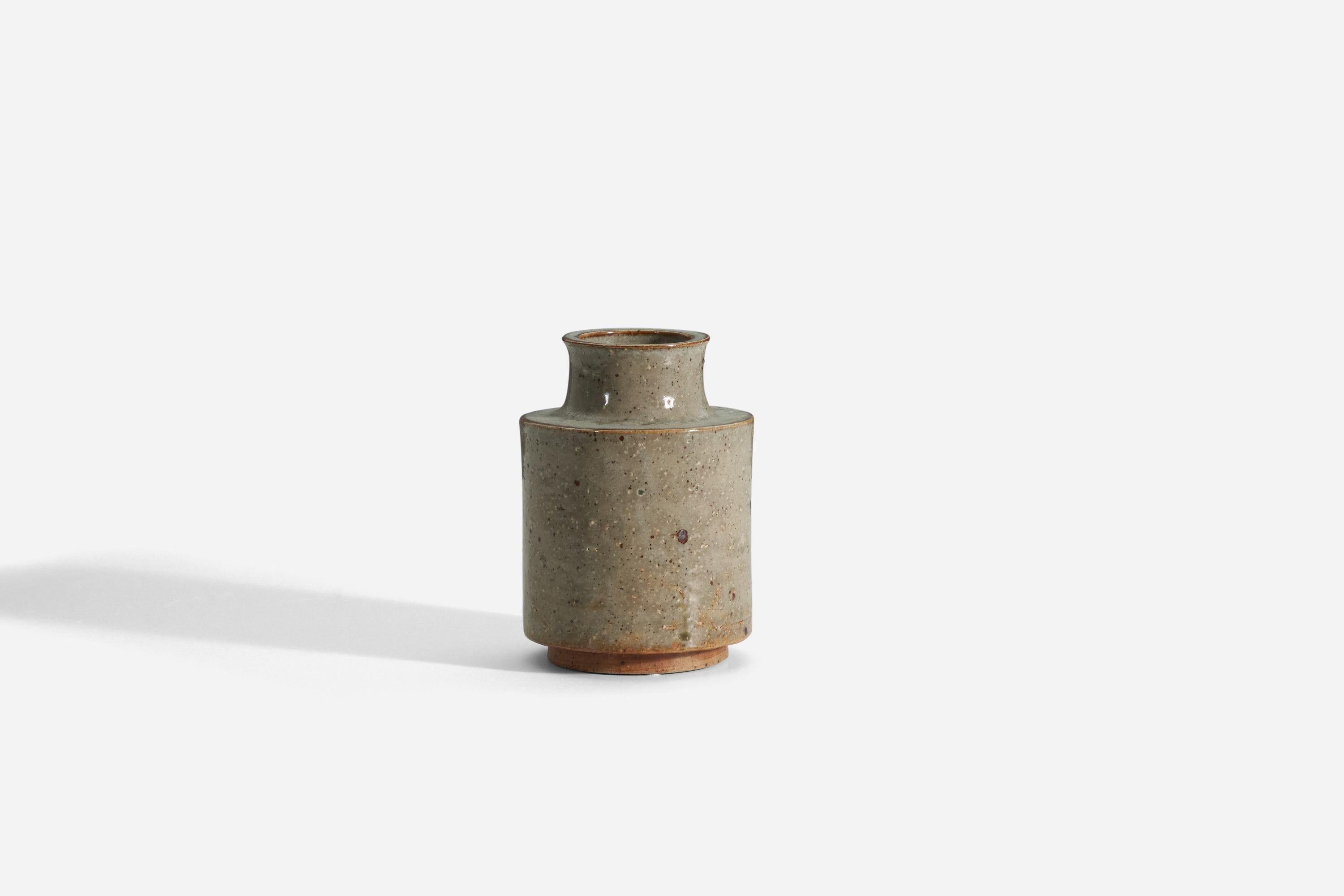 A vase in a grey glazed firesand, designed by Marianne Westman, produced by Rörstrand, Sweden, c. 1965. With signature to underside. 
 