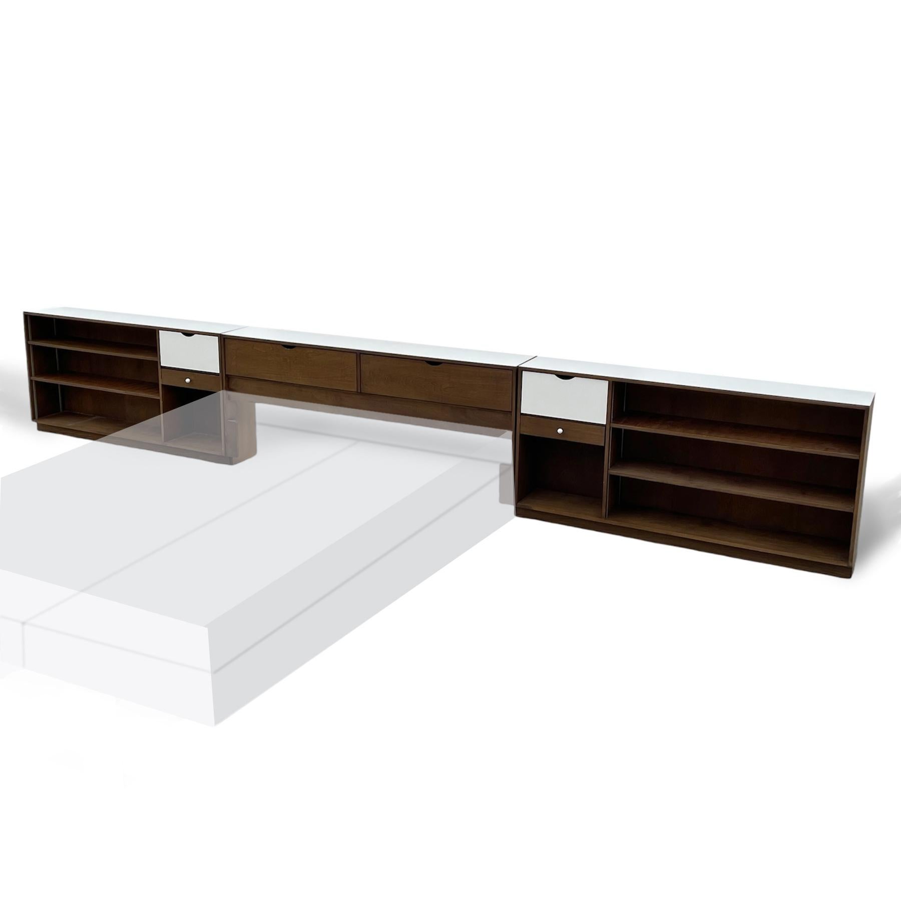 This very large, very impressive piece designed by Marianne Willisch features a king-size storage headboard is flanked by two large nightstands/ bookcases.

Willisch (Austrian, born 1897) was an important interior designer inspired by Bauhaus