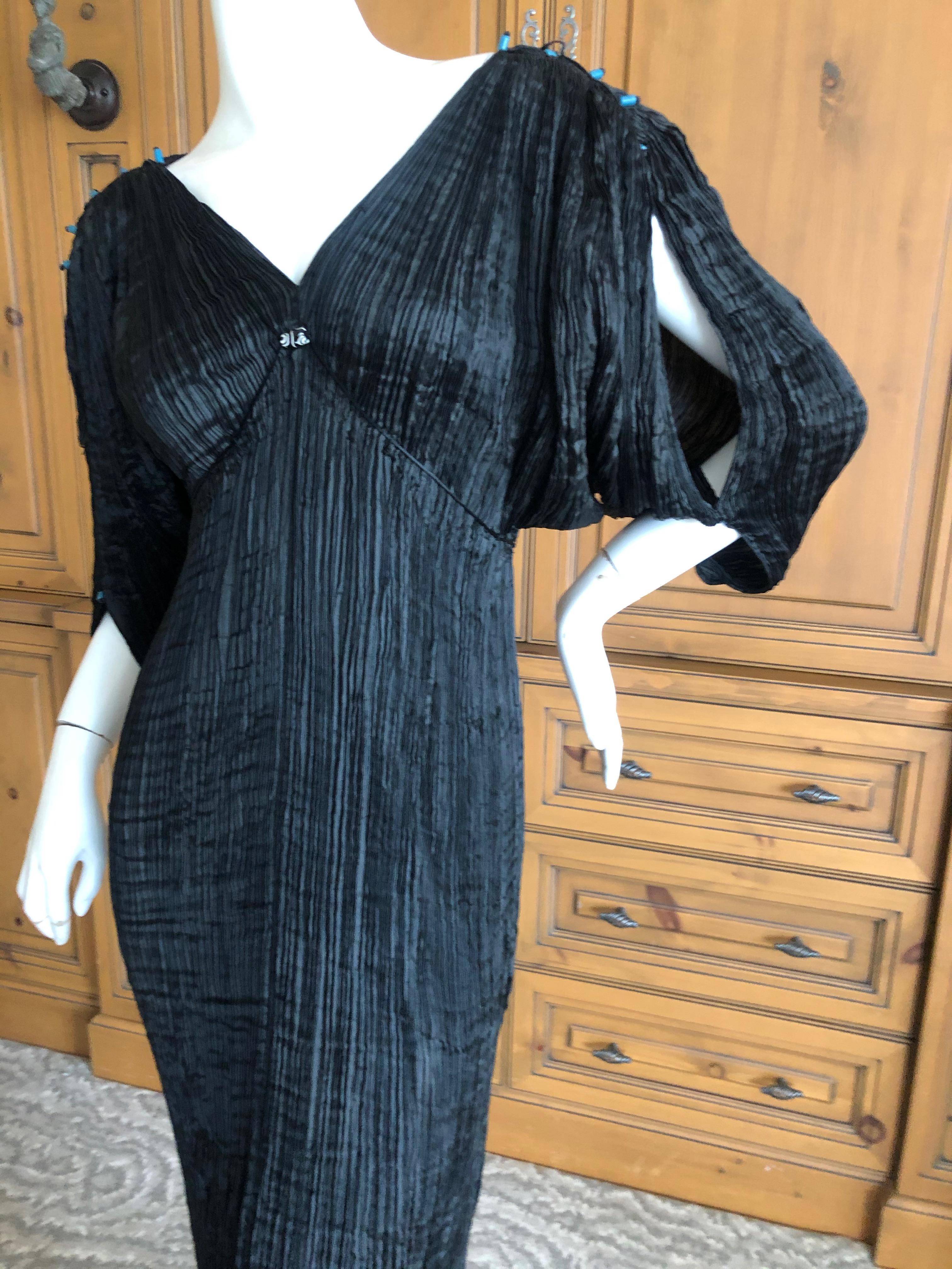 Mariano Fortuny Attributed Black Delphos Dress
Mariano Fortuny revolutionized fashion when he eliminated the corset and designed the pleated Delphos gown to be worn without restrictive undergarments.
Created by a secret pleating method and
