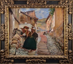 Spanish woman loading her donkey in the town street
