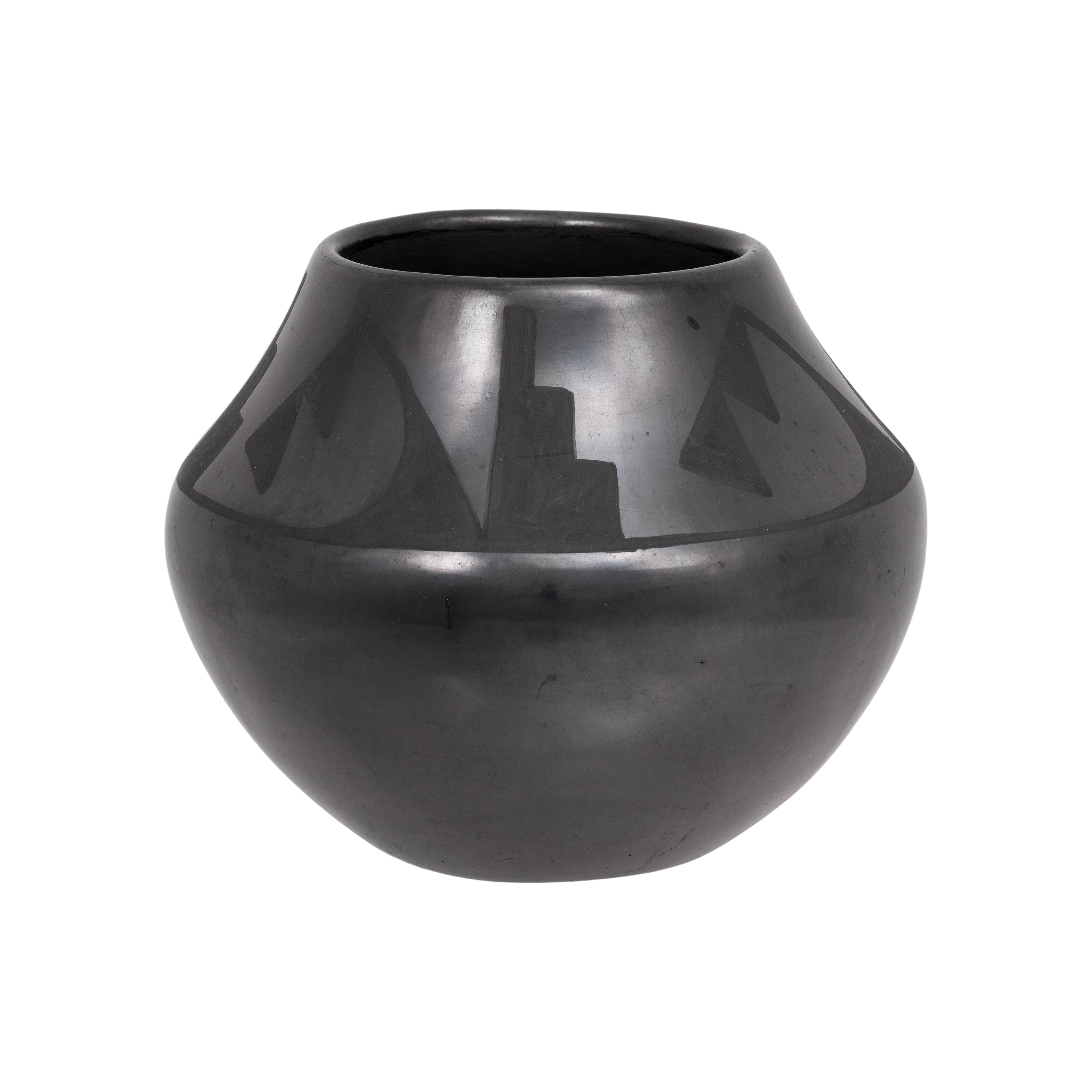 Maria and Santana Martinez Black Ware bowl. Geometric black on black pottery bowl by Maria Martinez, signed Maria and Santana. 1943 - 1956; 4 1/4