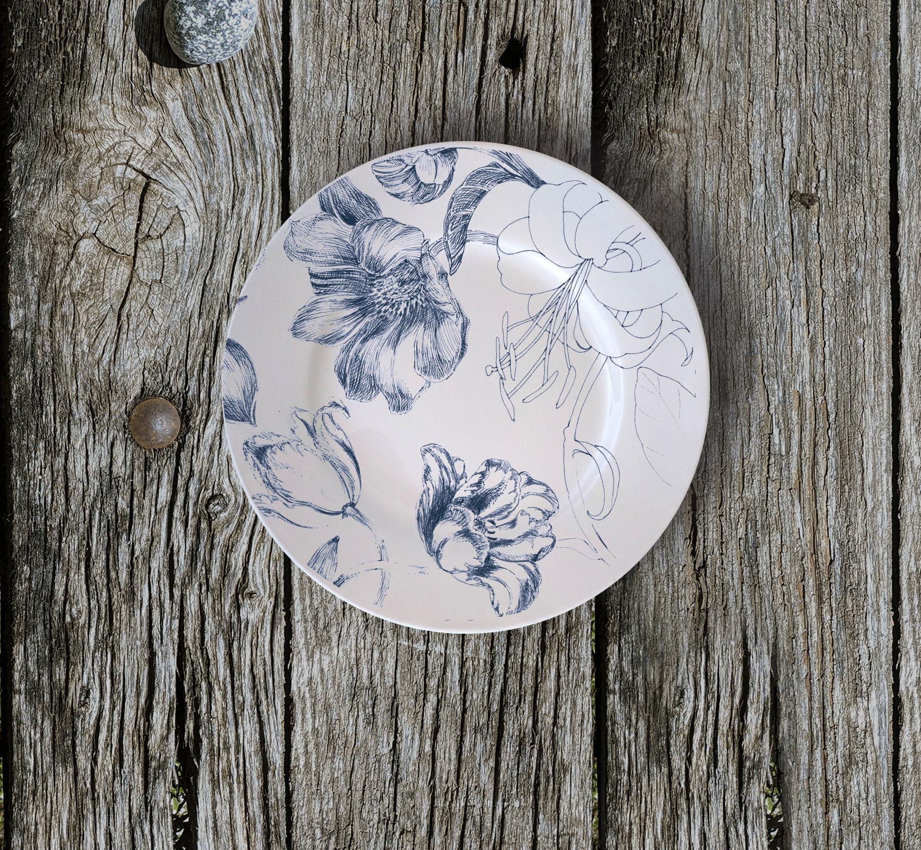 Marie Antoniette bread plates, are designed as the porcelain set of a contemporary Queen Marie Antoniette, still alive in 2020. It is an explosion of detailed flowers and blossoms, originally hand-painted with an engraving technique that is some