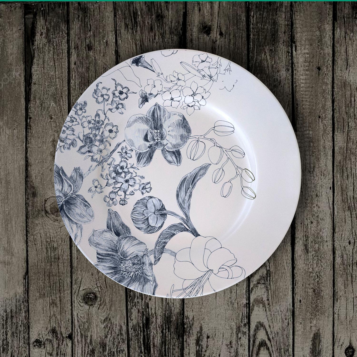Marie Antoniette dessert plates, are designed as the porcelain set of a contemporary Queen Marie Antoniette, still alive in 2020. It is an explosion of detailed flowers and blossoms, originally hand-painted with an engraving technique that is some