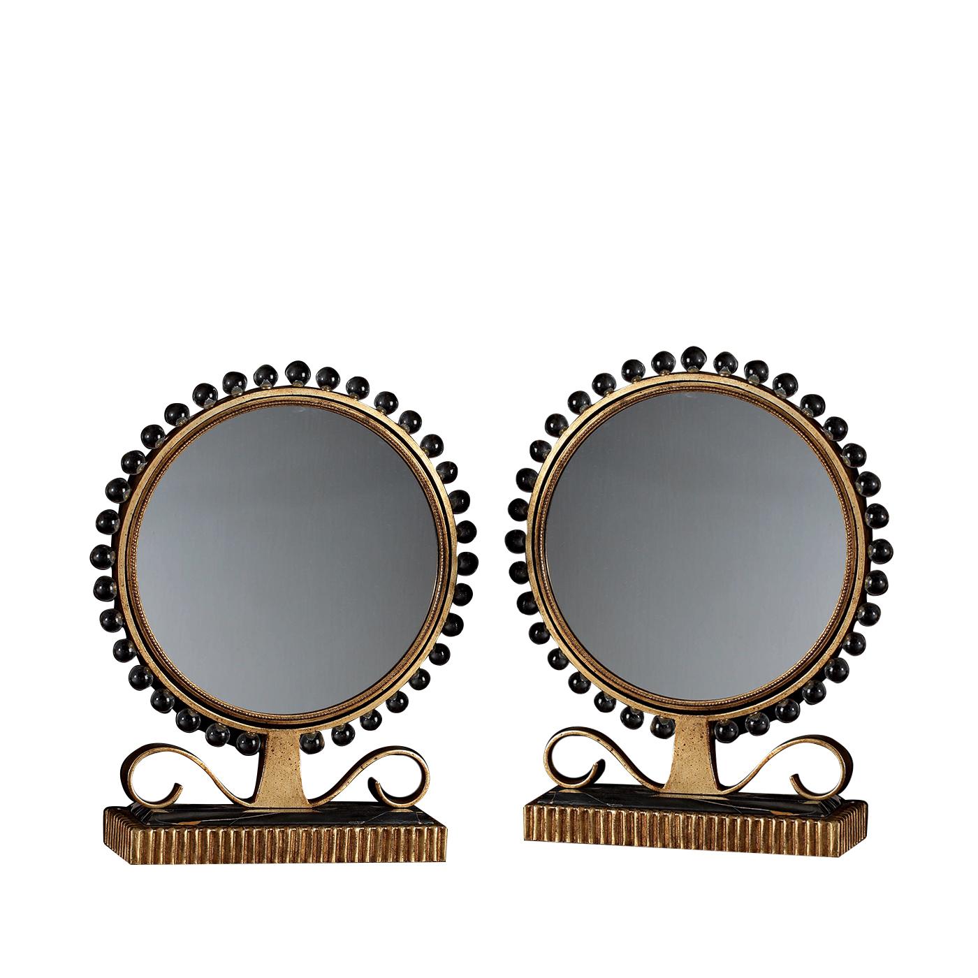 A superb piece of functional decor, this mirror can be placed on a mantelpiece, in an entryway, or in a powder room to add a magnificent accent of understated luxury and elegance. The hand forged iron structure has an aged gold finish that gives it