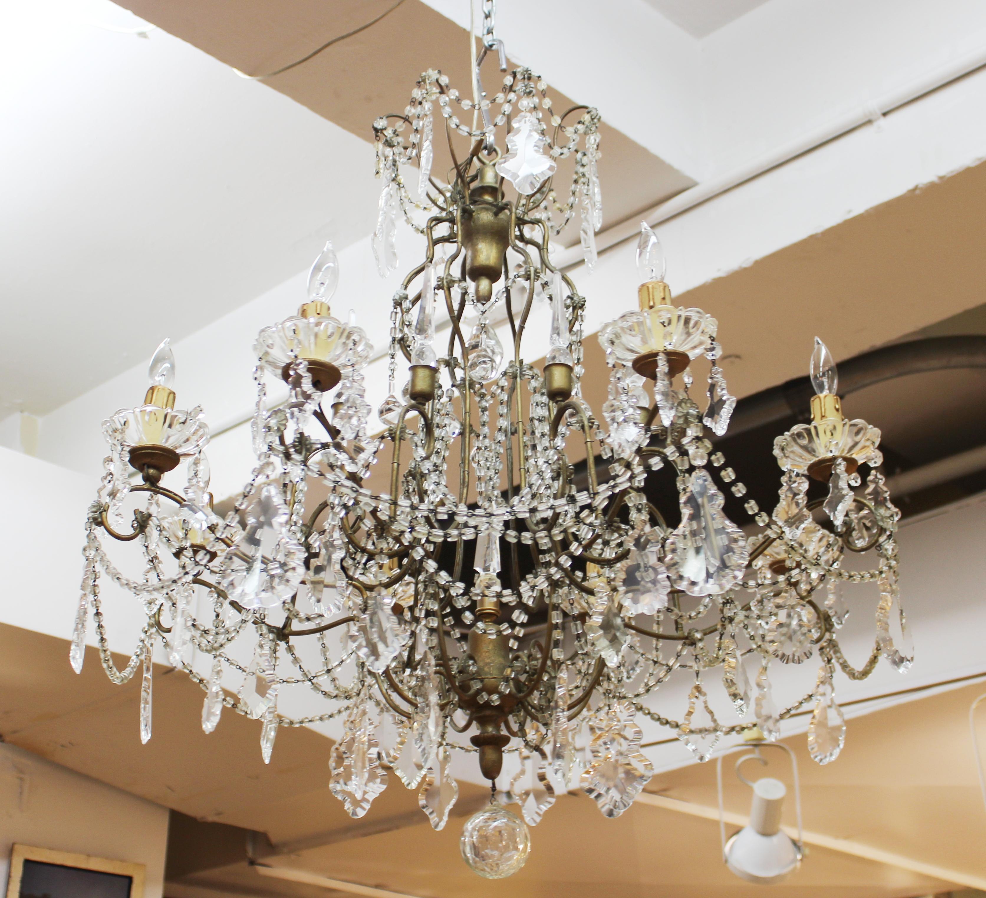 Marie Antoinette rare French chandelier with large pendeloque crystals and roped crystal garlands, made in France during the 1930's. The chandelier has 8 lights and a 24 inch chain with matching canopy piece. Rewired and with some crystals replaced.