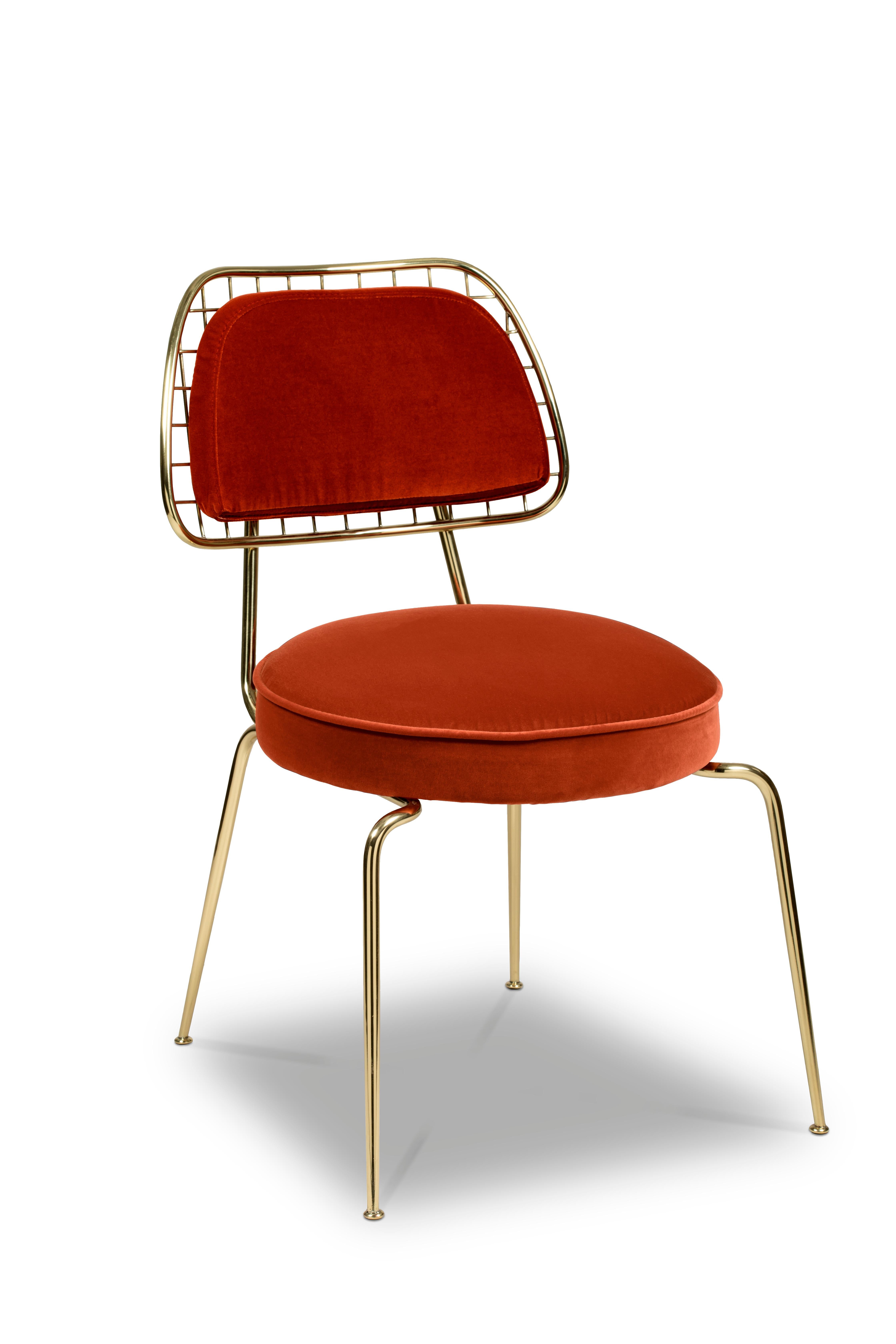 Marie is a rather an occasional dining chair that incorporates all of the mid-century elements into a contemporary vision. Its construction features slim legs made of polished brass, a round pad upholstered with a seductive velvet and a round back.