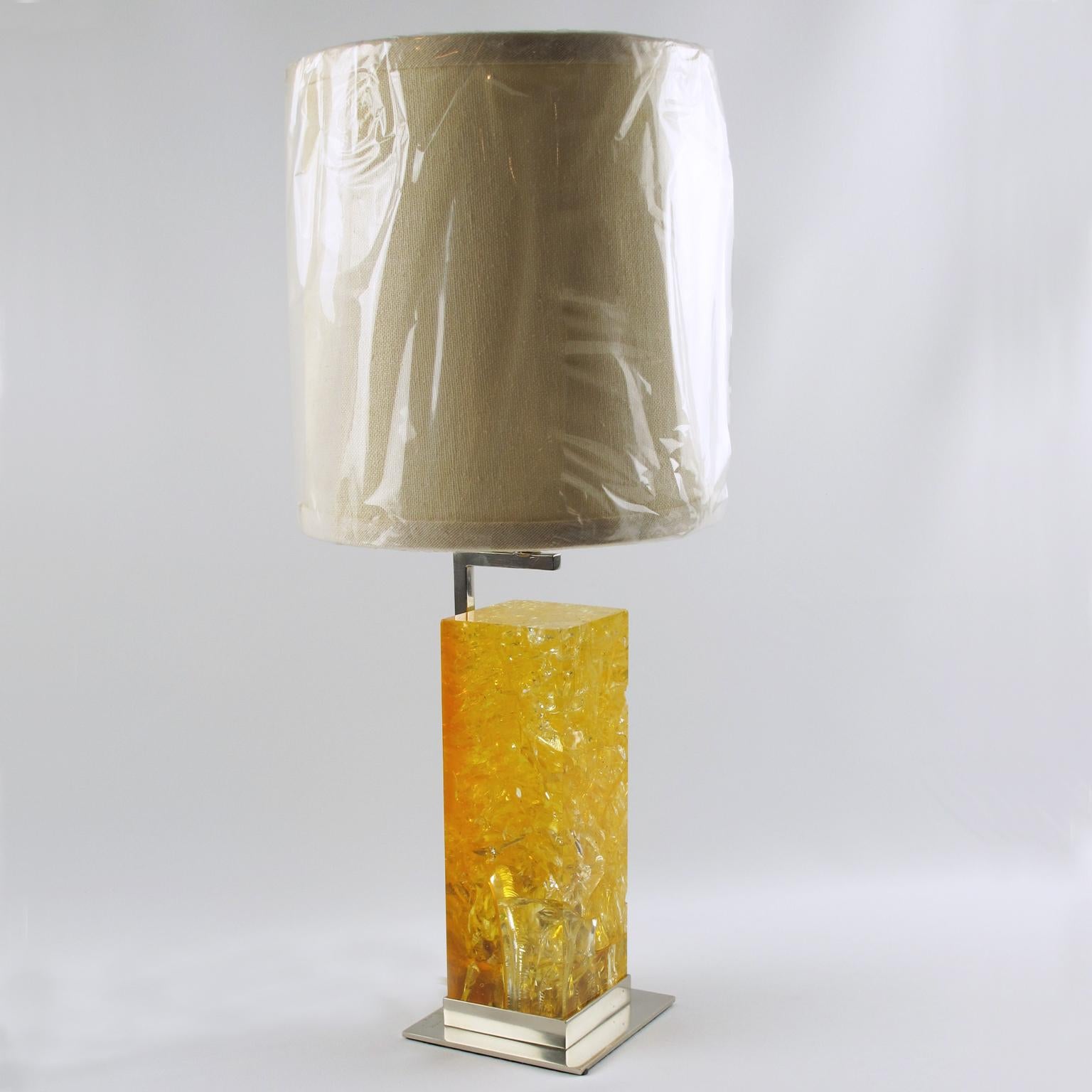 French designer Marie-Claude de Fouquieres designed this stunning fractal resin table lamp for the French lighting company Ombre et Lumiere, Paris, in the 1970s. The piece boasts a large resin block with a vivid yellow color, nickel-plated base, and