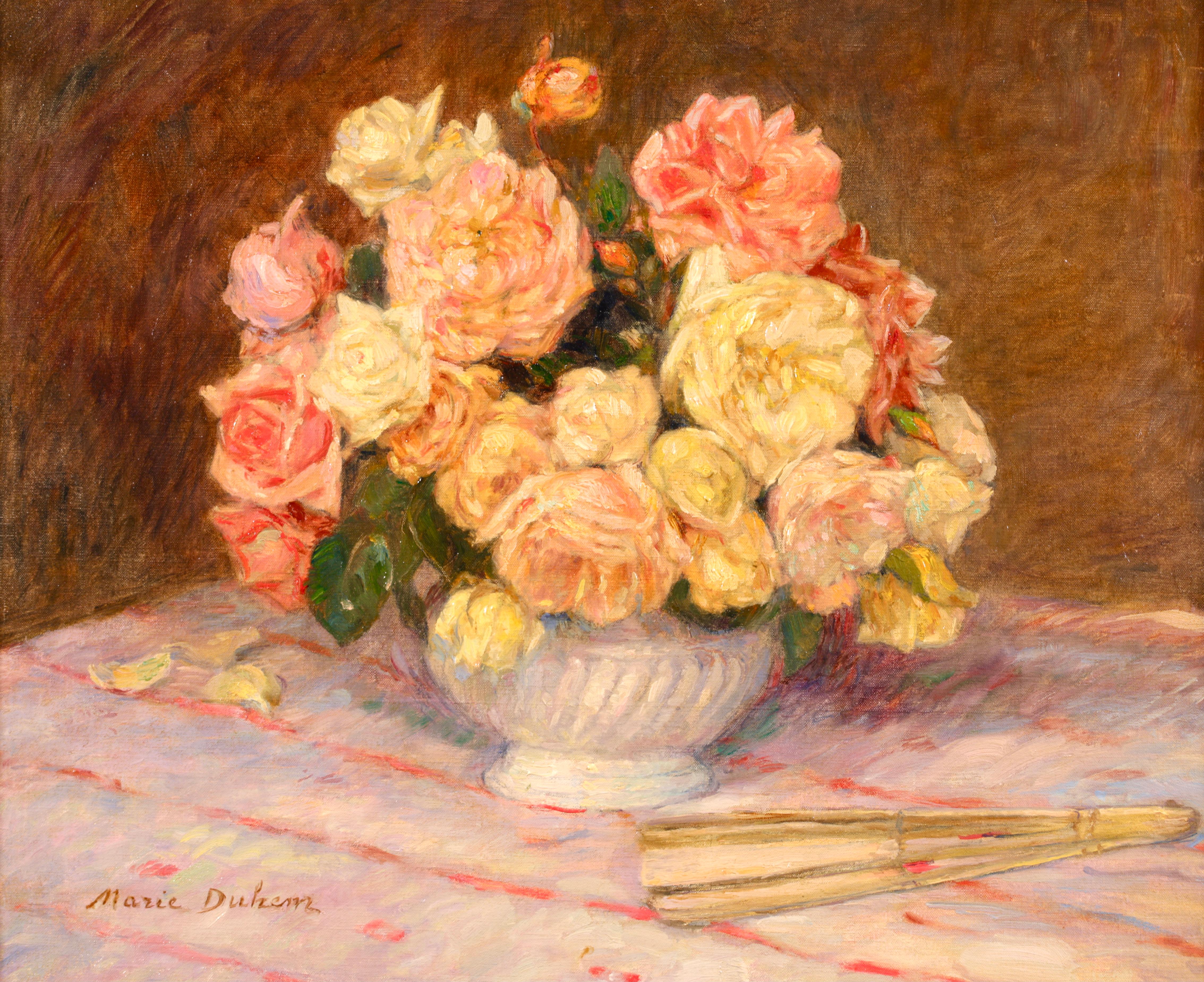 Signed and titled still life oil on canvas circa 1900 by French impressionist painter Marie Duhem. This stunning piece depicts pink and yellow roses in a white ceramic vase with a fan resting beside it. A truly beautiful painting.

Signature
Signed