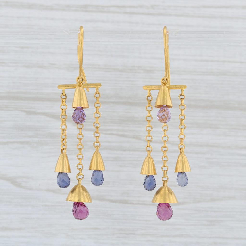 These earrings are a Marie Helene de Taillac design featuring elegant circle links with a bell like base accented by sparkling gemstone briolettes.

Gem: Natural Amethyst - 5 x 3.2 mm, Briolette Cut, Purple Color
- Natural Iolite - 5 x 3 mm,