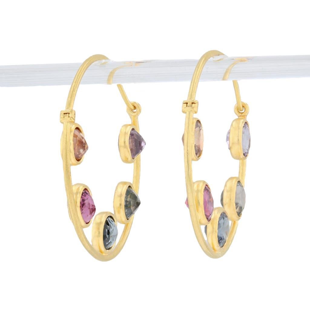 These beautiful hoop earrings are a Marie Helene de Taillac design. Each round hoop is accented by colorful genuine spinel gemstones. These hoops secure easily with hinged bars which pass through a circle hoop closure.

Gem: Natural Spinel - 8.44