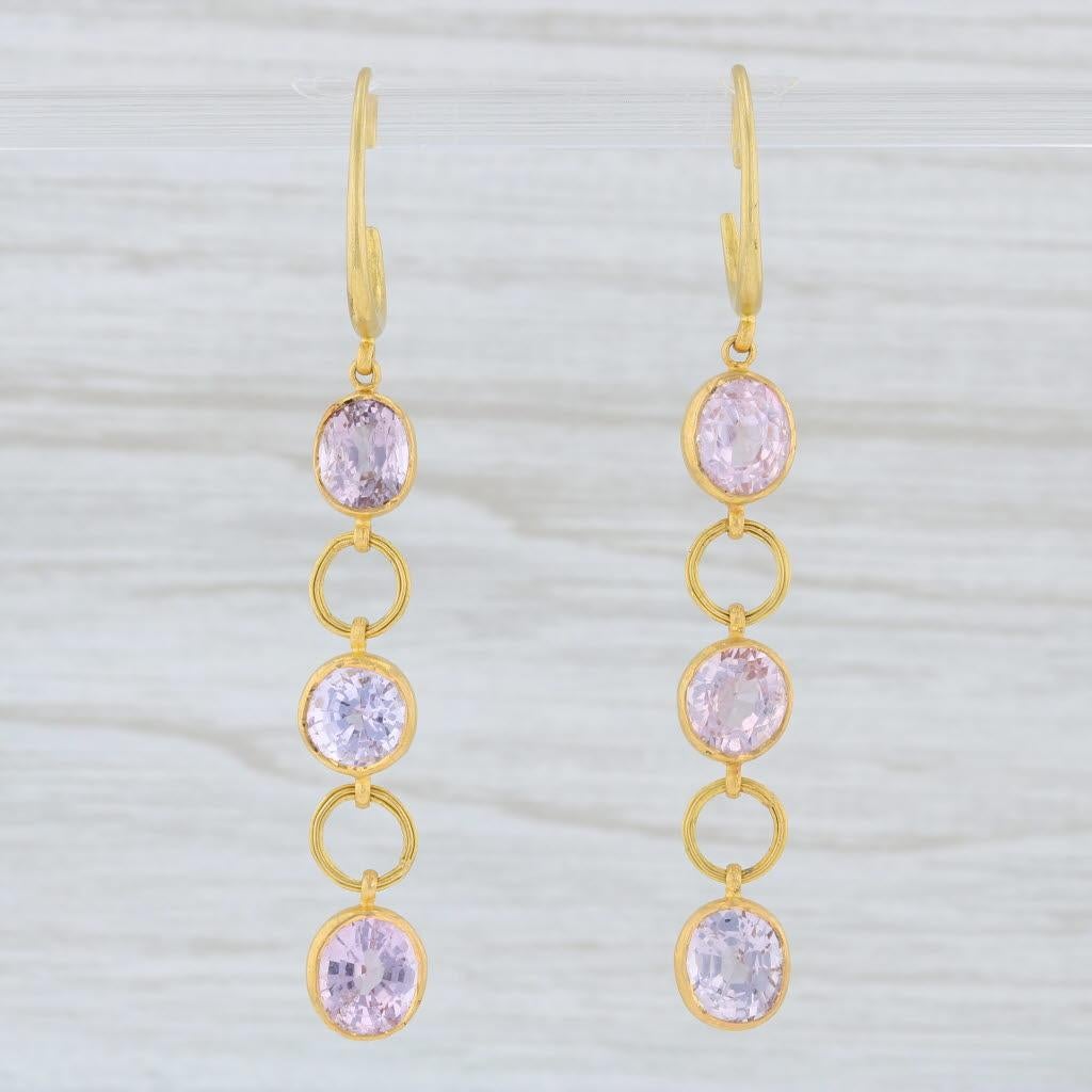These earrings are a Marie Helene de Taillac design featuring elegant circle links accented by sparkling pink spinel gemstones.

Gem: Natural Spinel - 6.80 Total Carats, Oval and Round Brilliant Cut, Pink Color
Metal: 22k Yellow Gold (XRF