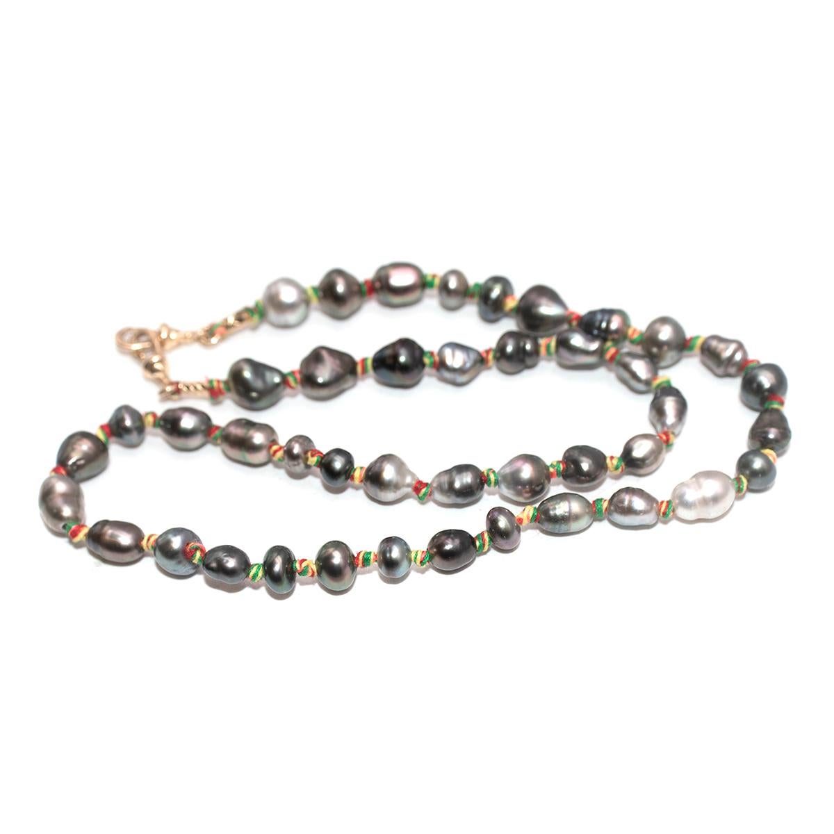 Marie Lichtenberg Mauli Full Black Pearl Single-Strand Necklace

- Single strand, natural black pearl necklace, interspersed with multicoloured thread knots
- Natural shape and colour variation through the pearls, from a deep inky hue to lighter