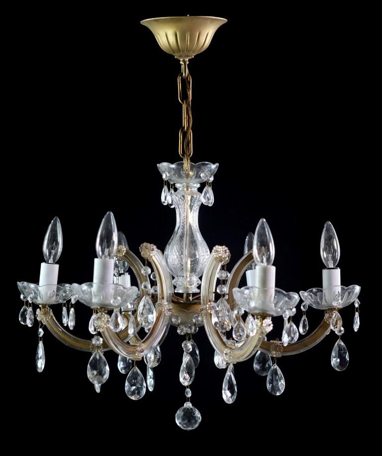 20th century Marie Therese chandelier featuring six arms. Brass finished frame supports the glass crystal arms. This can be seen at our 400 Gilligan St location in Scranton, PA.