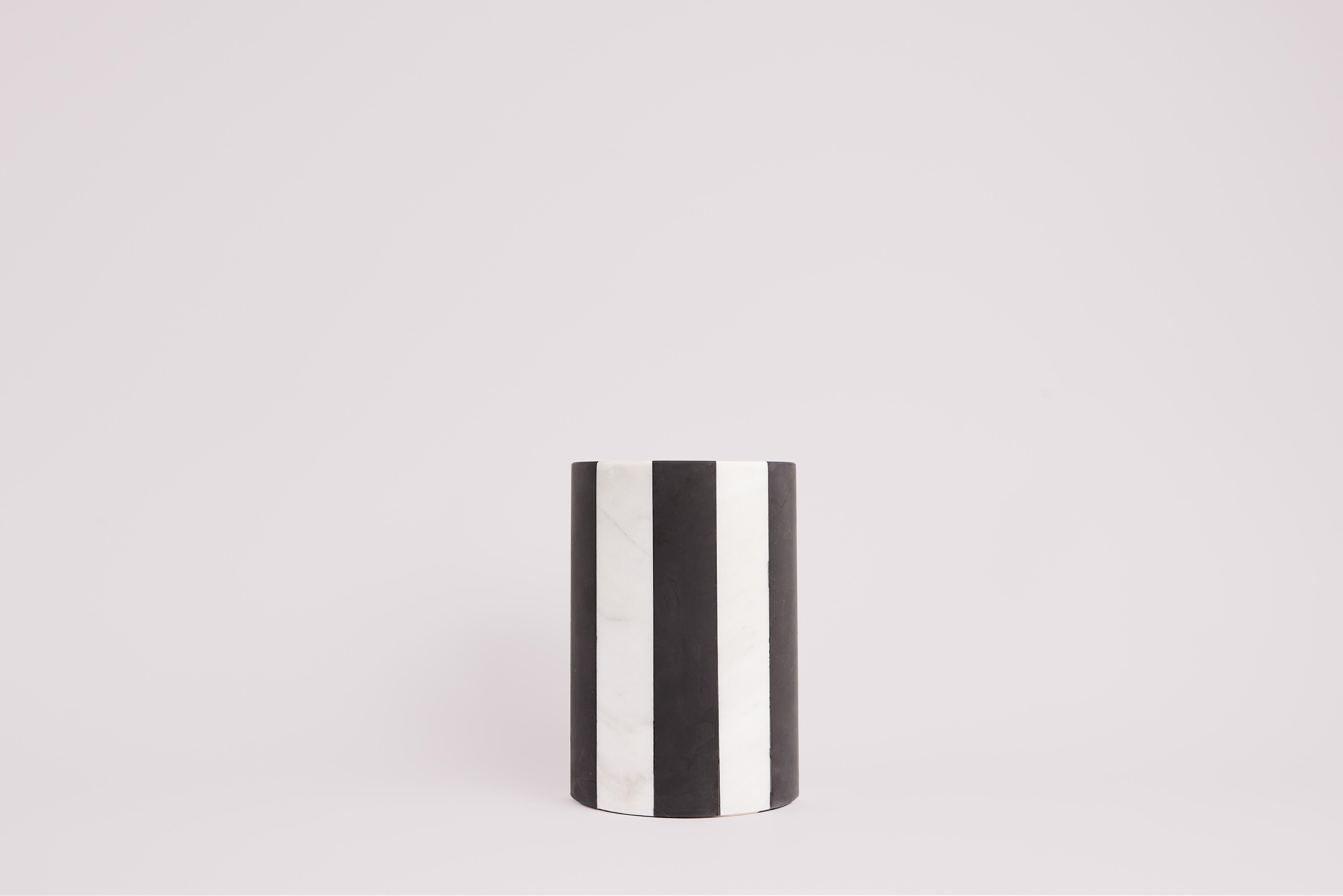 The black and white marble Marie vase, design by Studio Gaïa, is an elegant and modern decorative accessory that will add a graphic touch to any space. Made from high-quality marble, this planter features a subtle and chic striped pattern,