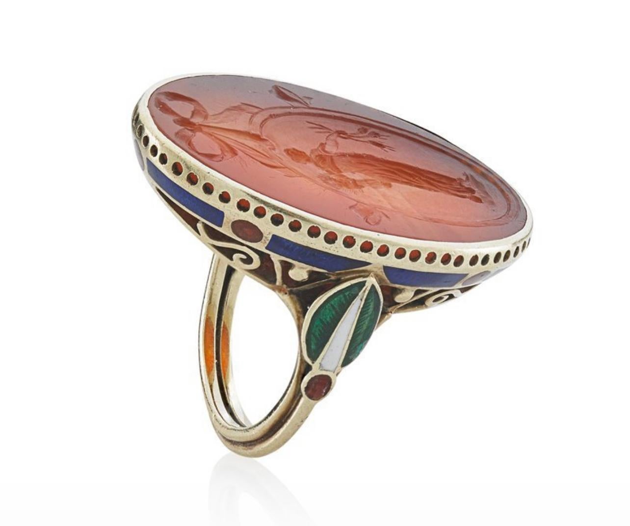 Much of Marie Zimmermann’s jewelry is institutionally owned, with the bulk belonging to the Metropolitan Museum in New York. Here is a rare example on the open market — a carnelian intaglio enamel and gold ring. Size 6.5, 7.1 dwt. In excellent