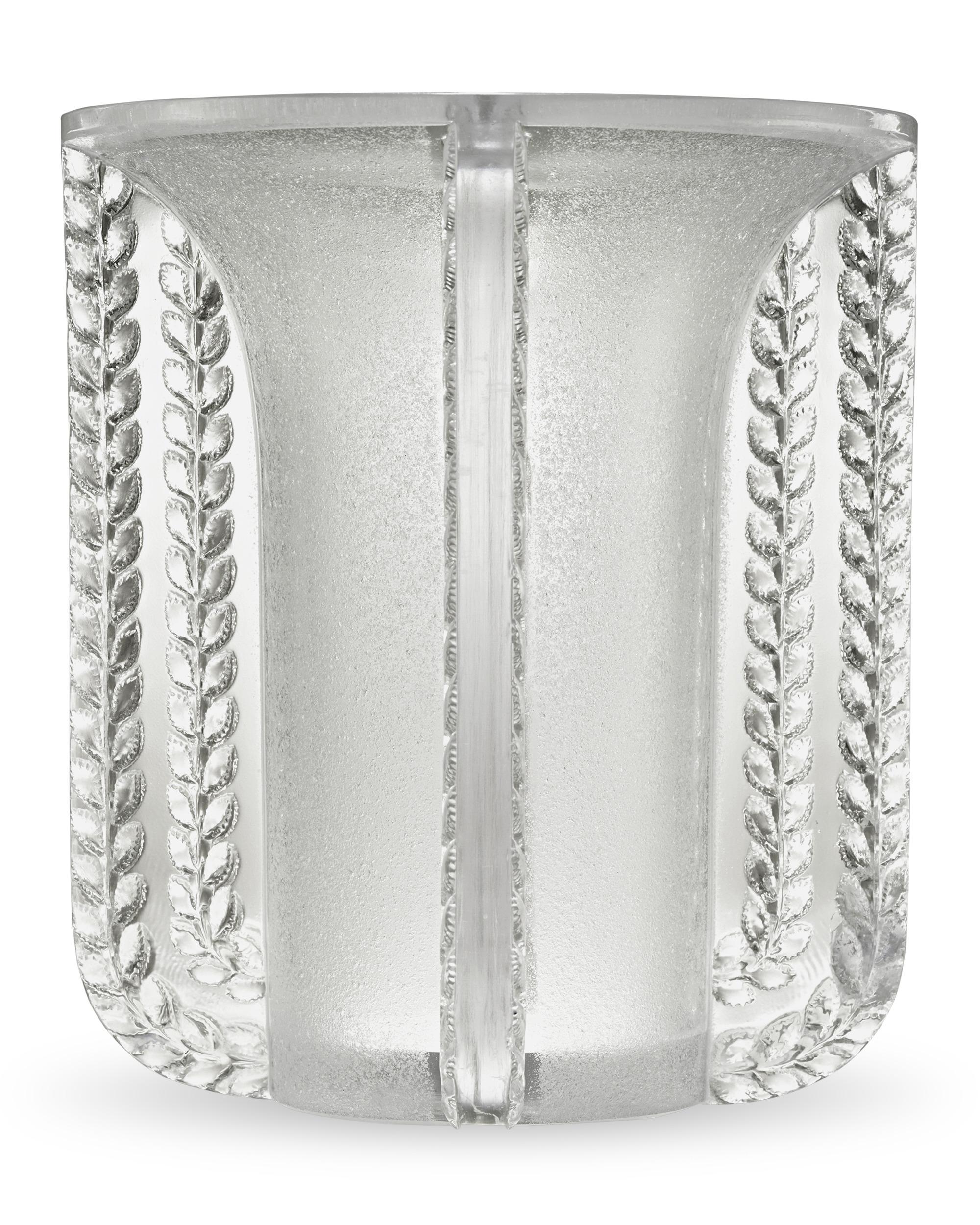 Named after a town in the south of France, this Marignane vase from French visionary René Lalique displays the ingenuity and stellar craftsmanship for which the firm is renowned. The design features highly frosted glass on the body of the vase,