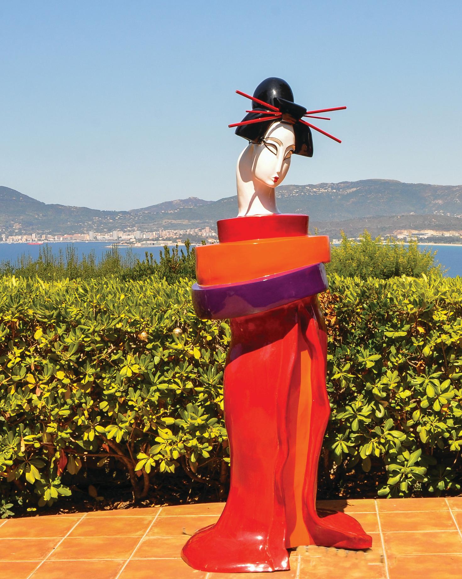Mariko’s Gueishas are unique monumental contemporary sculptures made of resin and reinforced with an inside metallic structure, finished with a bi-component urethane paint, extremely resistant to UV exposure and outside weather. 
Mariko grew up in