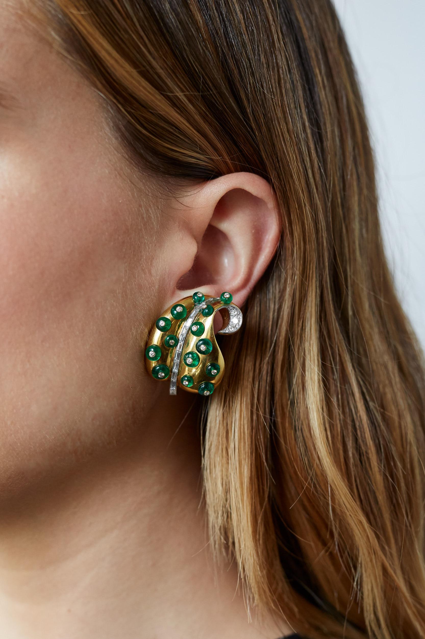 A pair of one-of-a-kind 18 karat gold, diamond and emerald bead leaf earrings, by late contemporary jeweler Marilyn Cooperman. 

One earring back stamped MFC.