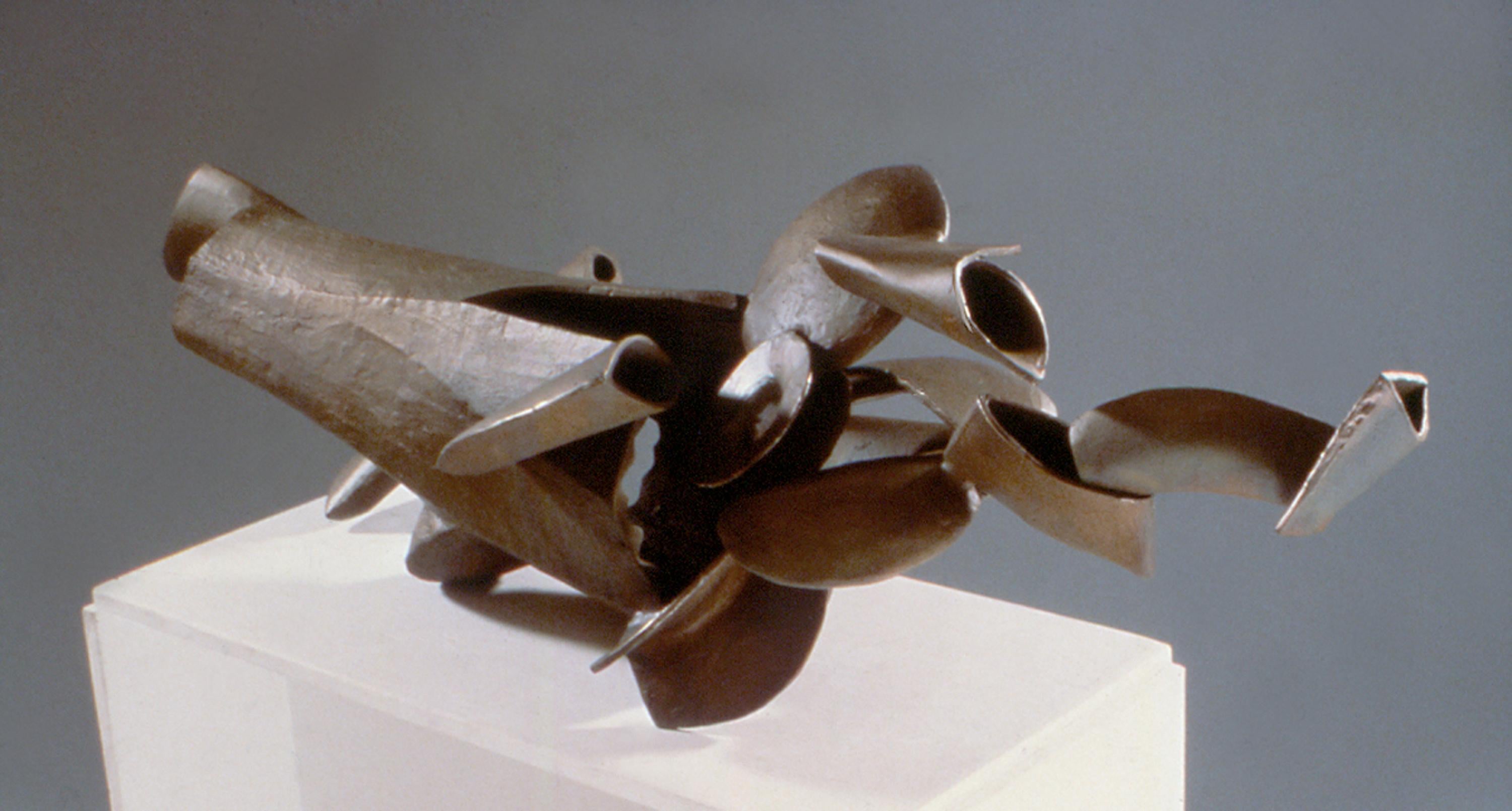 “Total Recall”, cascading bronze shapes burst from a hollow oceanic form - Sculpture by Marilyn Davidson