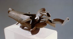 “Total Recall”, cascading bronze shapes burst from a hollow oceanic form