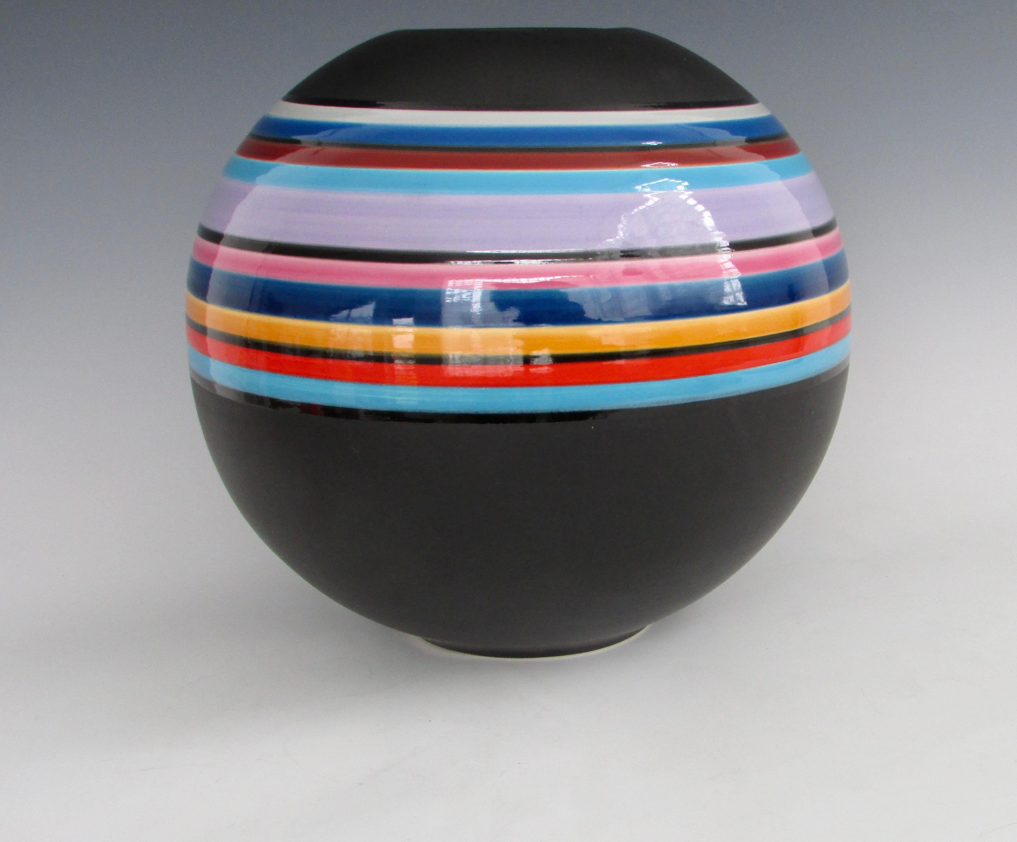 Bulbous shape matte black vase with multi colored bands in gloss finish . Reminiscent Of Marilyn Kay Austin work for Architectural Pottery .