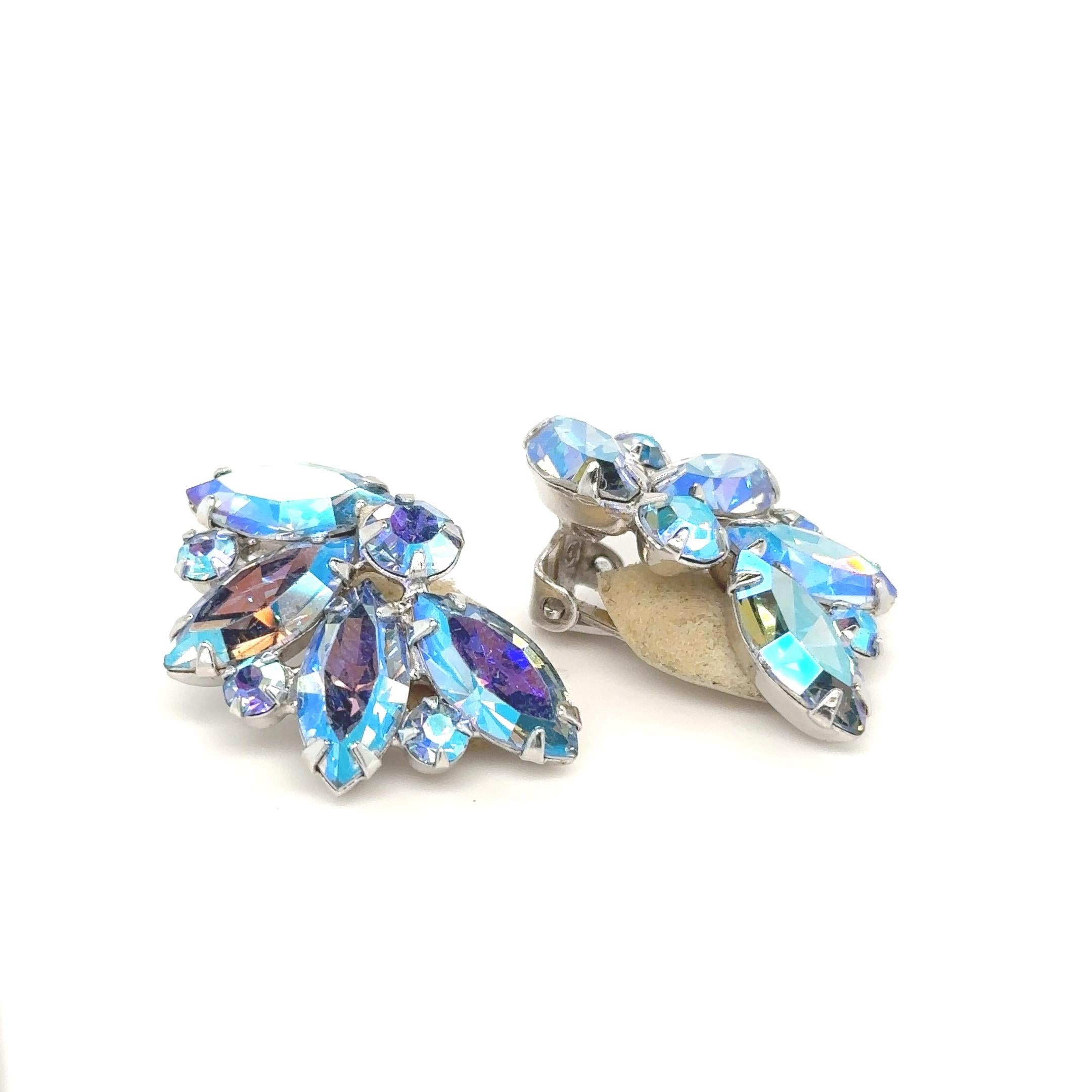 Marquis and round cut iridescent crystal stones in purple and blue tones. 
1 1/2 inches
Enhance your collection with these stunning multi-colored rhinestone earrings, adored by Marilyn Monroe for their exquisite complement to her iconic blonde