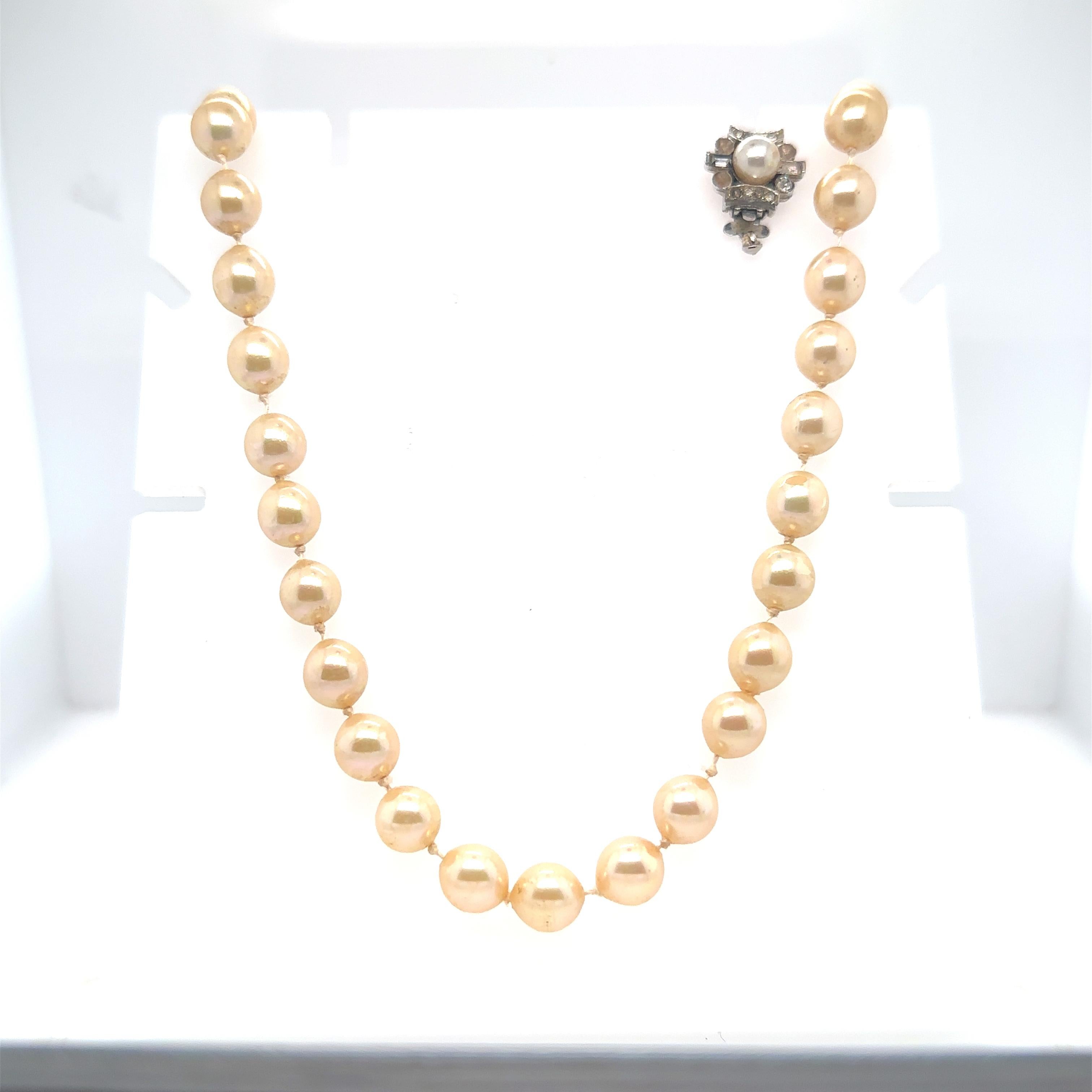 Single strand, costume pearl necklace signed 