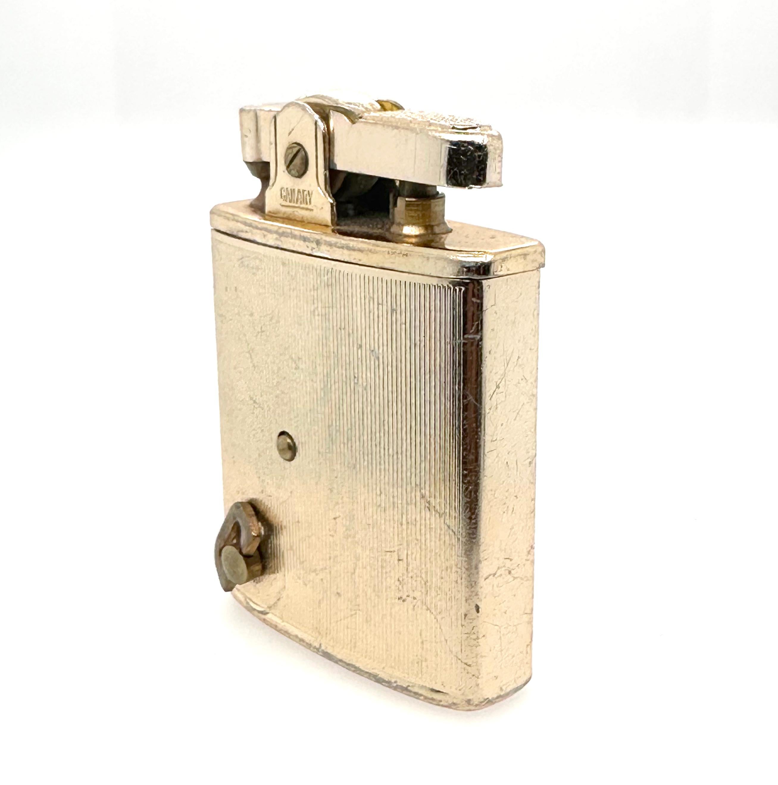 Metal lighter with painted image of the Imperial Hotel with script reading 
