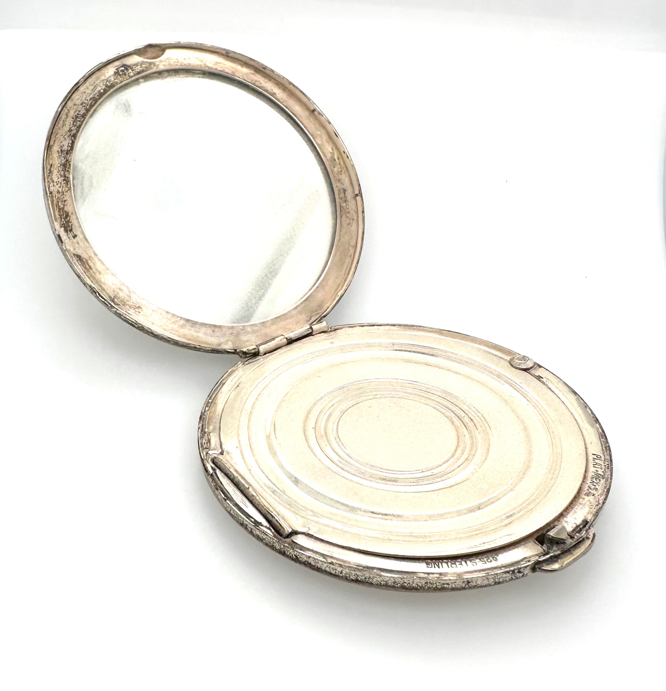 Portacipria da donna con specchietto con un design a foglie centrato su una singola 