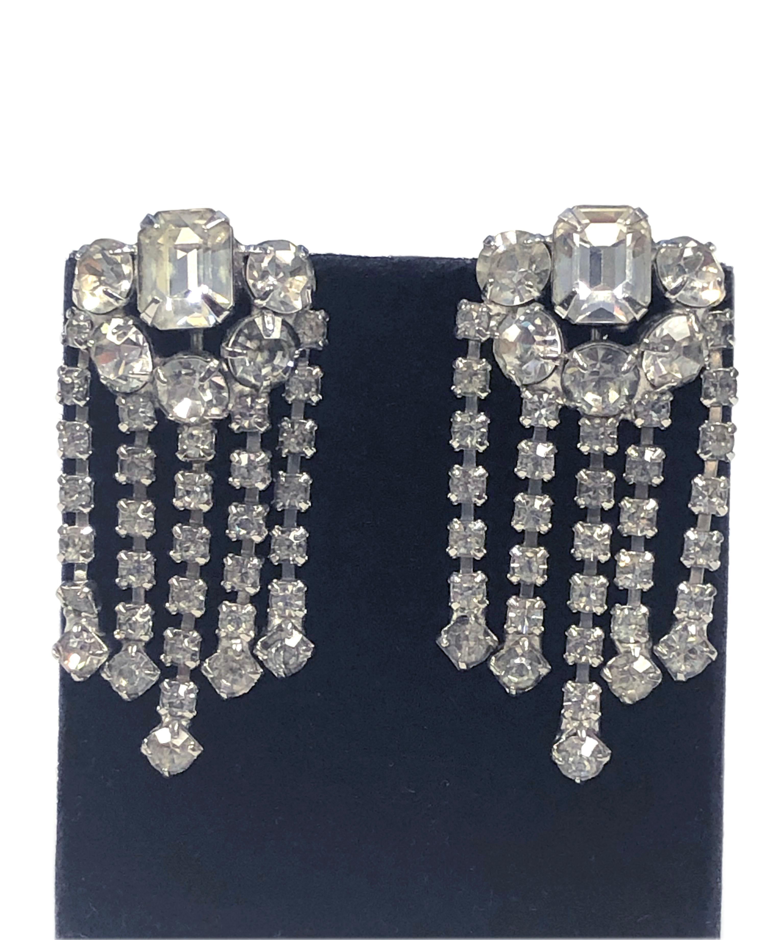 Circa 1950s White Metal and Paste Foil Back Crystal Earrings owned and worn by Icon Marilyn Monroe, set in White metal and  Measuring 2 inches in length and 1 inch wide, each stone is prong set, screw backs. Comes with the Original Auction catalog