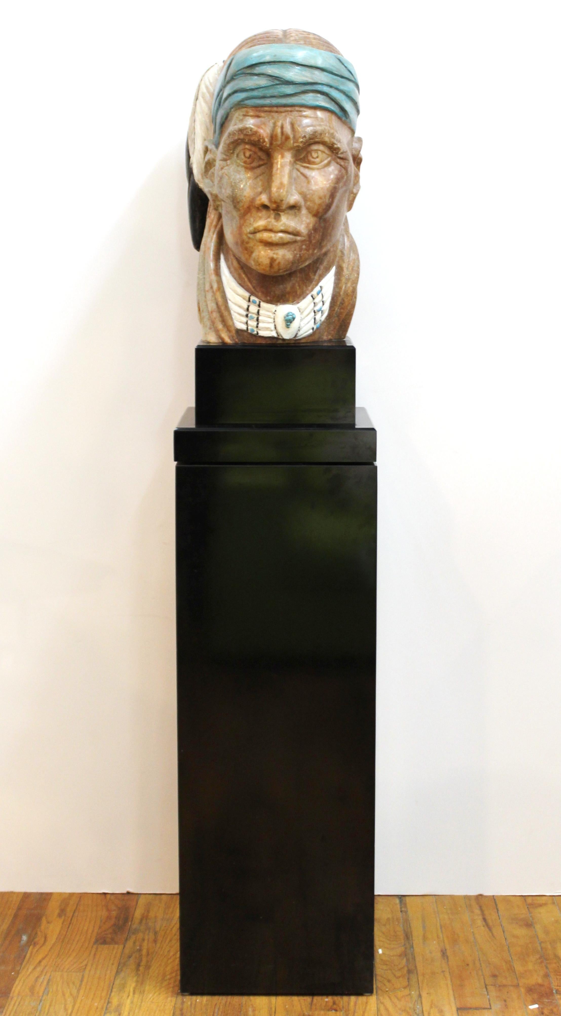 Marilyn Weinstein (NY, 1946-2020) 'Medicine Wolf' carved alabaster and mixed-media bust on a rotating black base, mounted on a black pedestal. Carved signature on the left side.

Weinstein studied art at New York University and the Sorbonne in