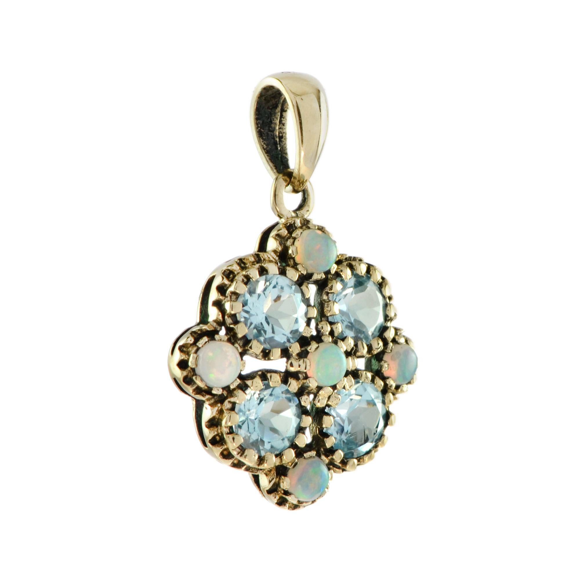 Impressive blue topaz and opal yellow gold floral pendant. Sky blue topaz is artfully fashioned with round pretty petals. Center of the flower and surround are arrayed with opals. It is a truly magnificent piece. 

Information
Style: