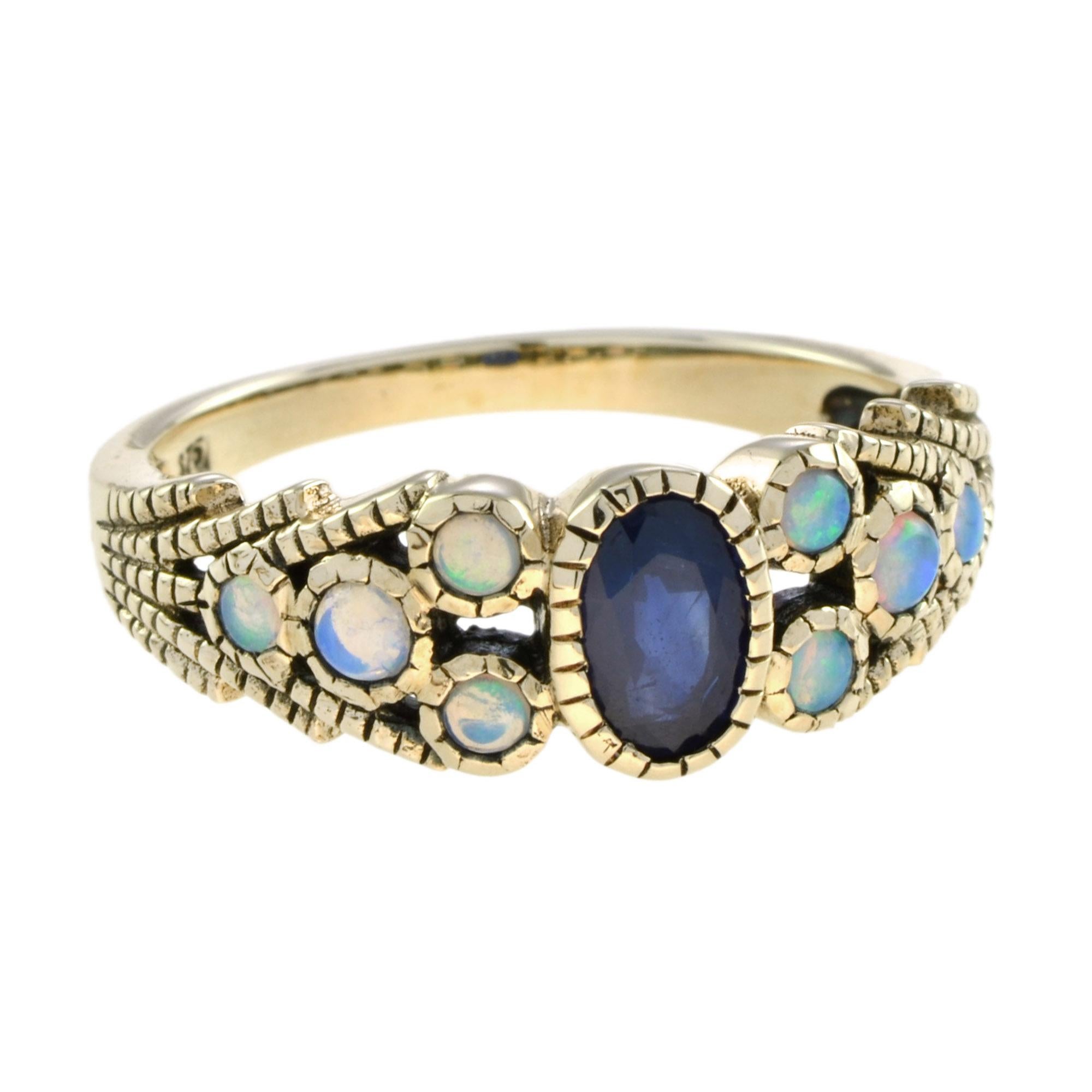 The delicate ring will make you feel like a chic woman with a thing for vintage design. With a center oval sapphire and opal accent, it is an envy piece for sure. 

Ring Information
Metal: 9K Yellow Gold 
Weight: 2.97 g. (approx. total weight)
Size: