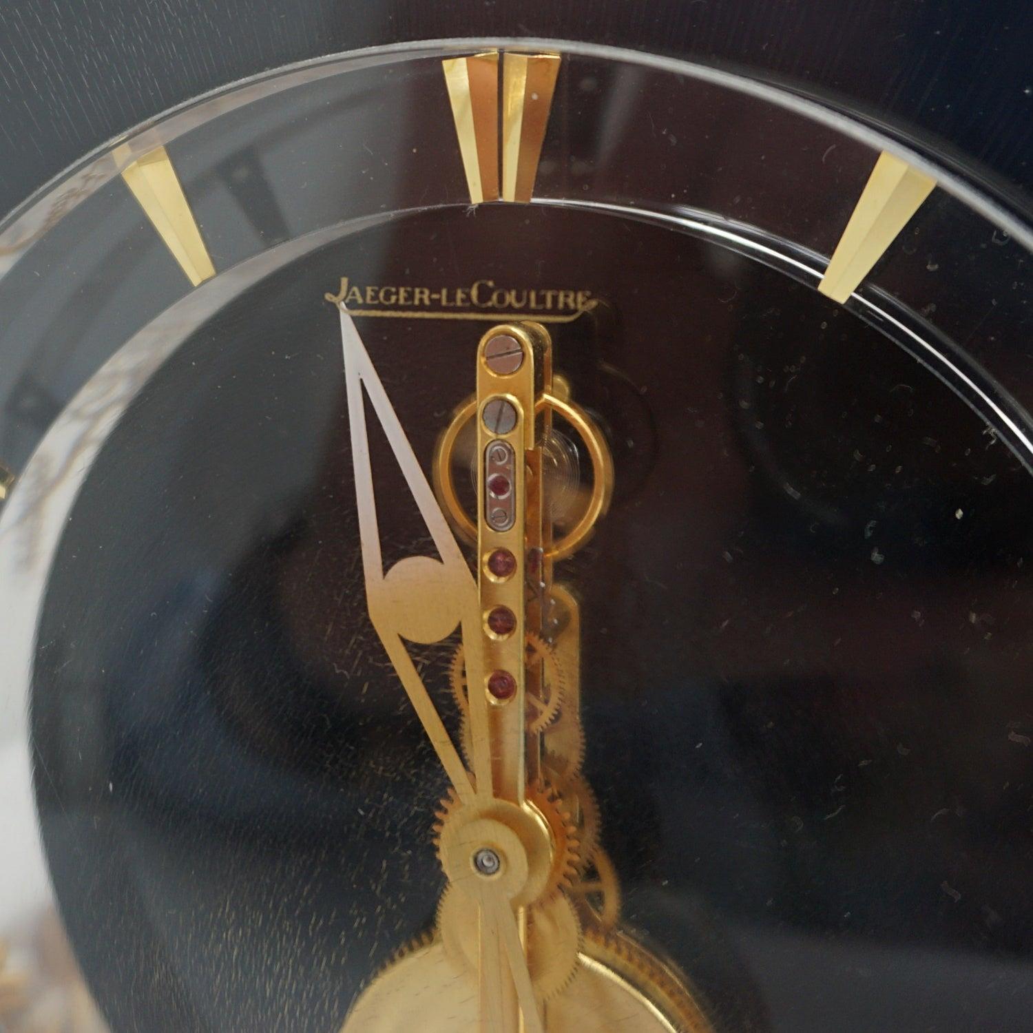 'Marina' A Mid-Century Jaeger-LeCoultre Mantel Clock Set Over a Brass Base 7