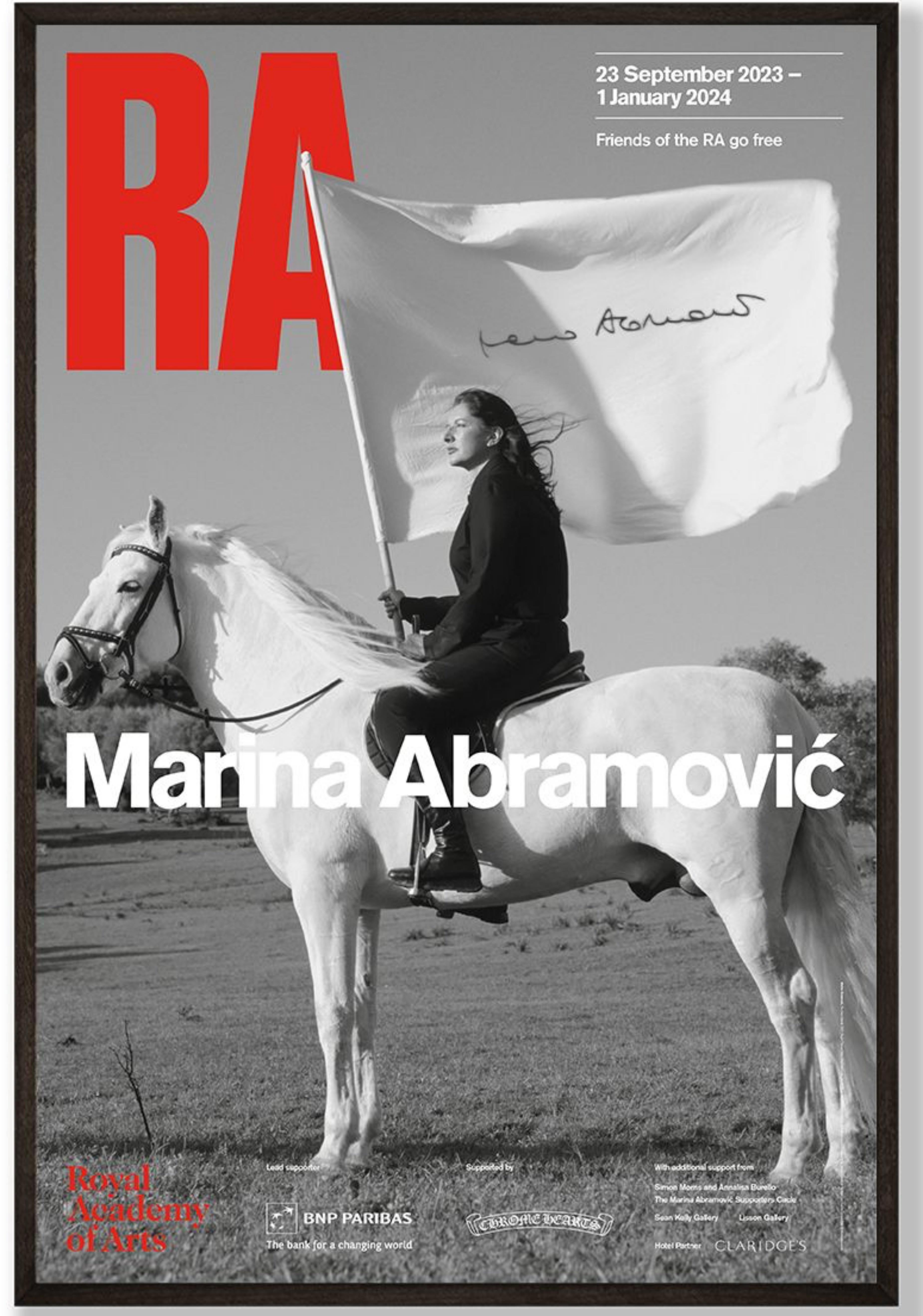 Marina Abramovic
Offset lithograph poster
The Hero, 2001 2023
Boldly signed in black marker on the image of the flag 
Bears Royal Academy authentication label on the back of the frame
On the occasion of her groundbreaking solo retrospective at the