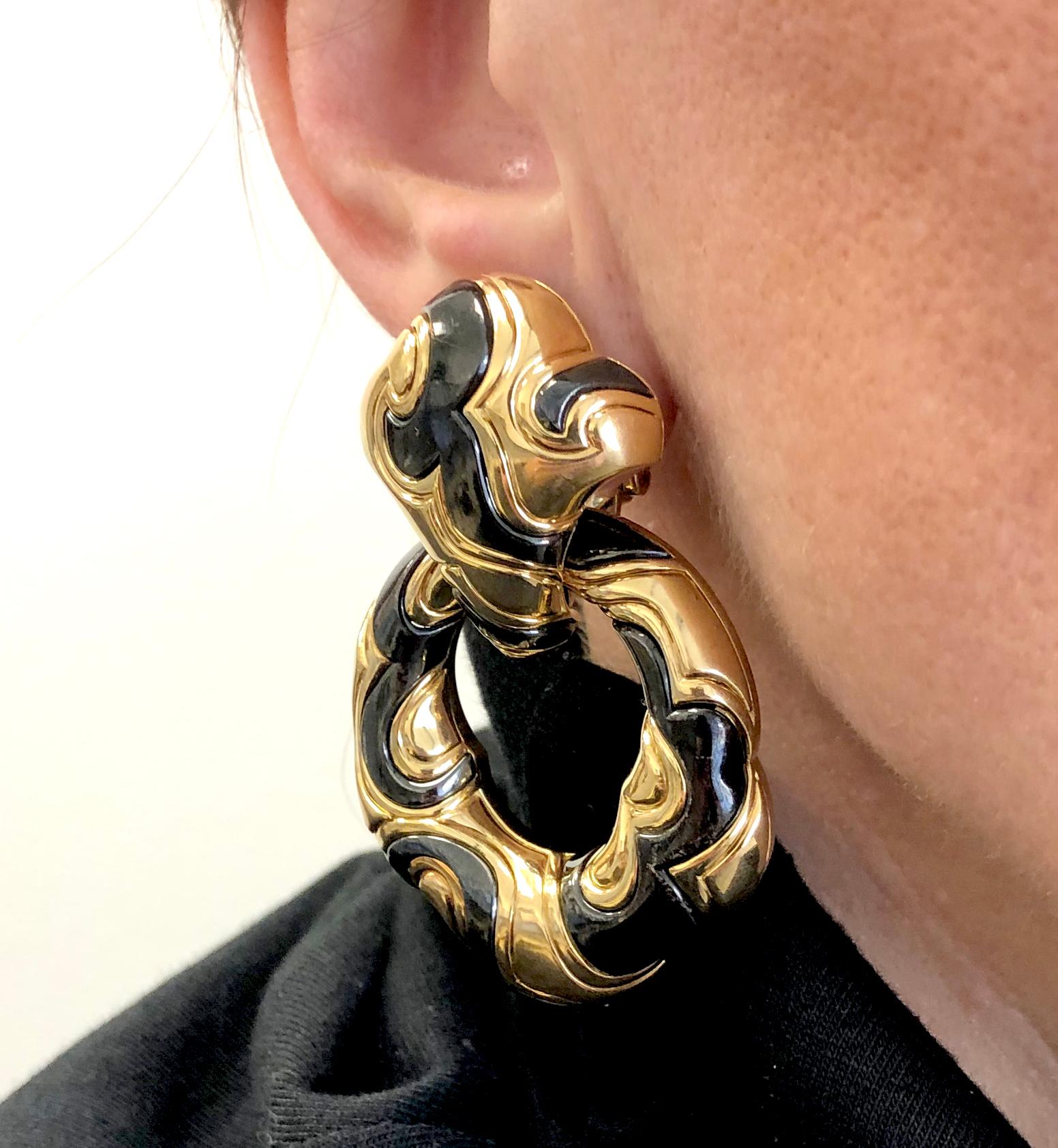 MARINA B Ken Detachable Hoop Earrings in Blackened 18k Yellow Gold.

An iconic and recognizable pair of Ken pattern on-the-ear clips by Marina B. The doorknocker-style pair can be adorned in two ways; the first as pictured with two pieces moving