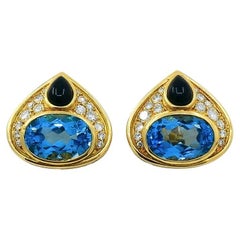 Marina B. Orecchini a clip in oro 18k con topazio, onice e diamanti.