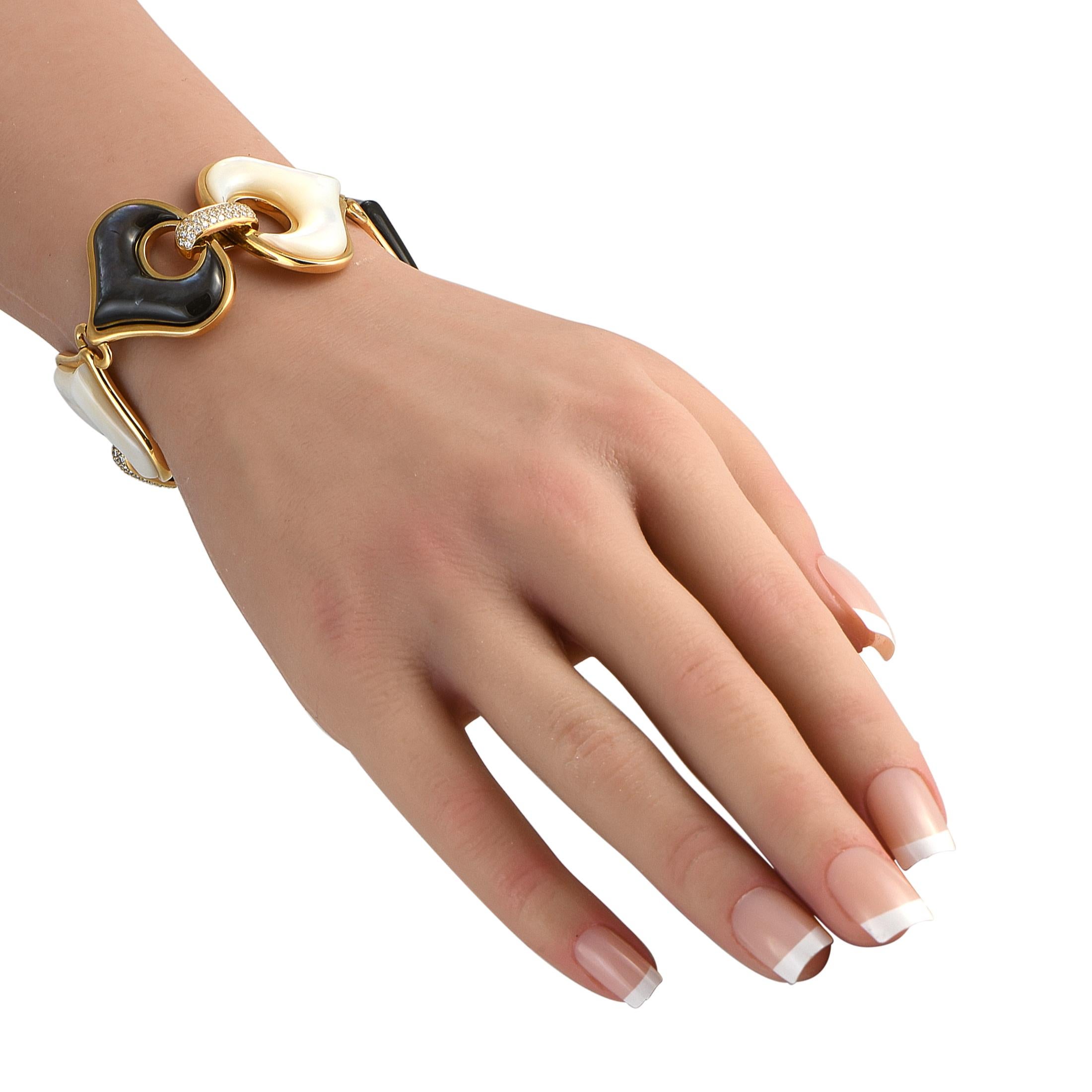Bold but forever in style. This Marina B. bracelet features six free-form links in 18K yellow gold, each alternately set with a natural white and black Mother-of-Pearl inlay. The links are connected by yellow gold clips covered with three rows of