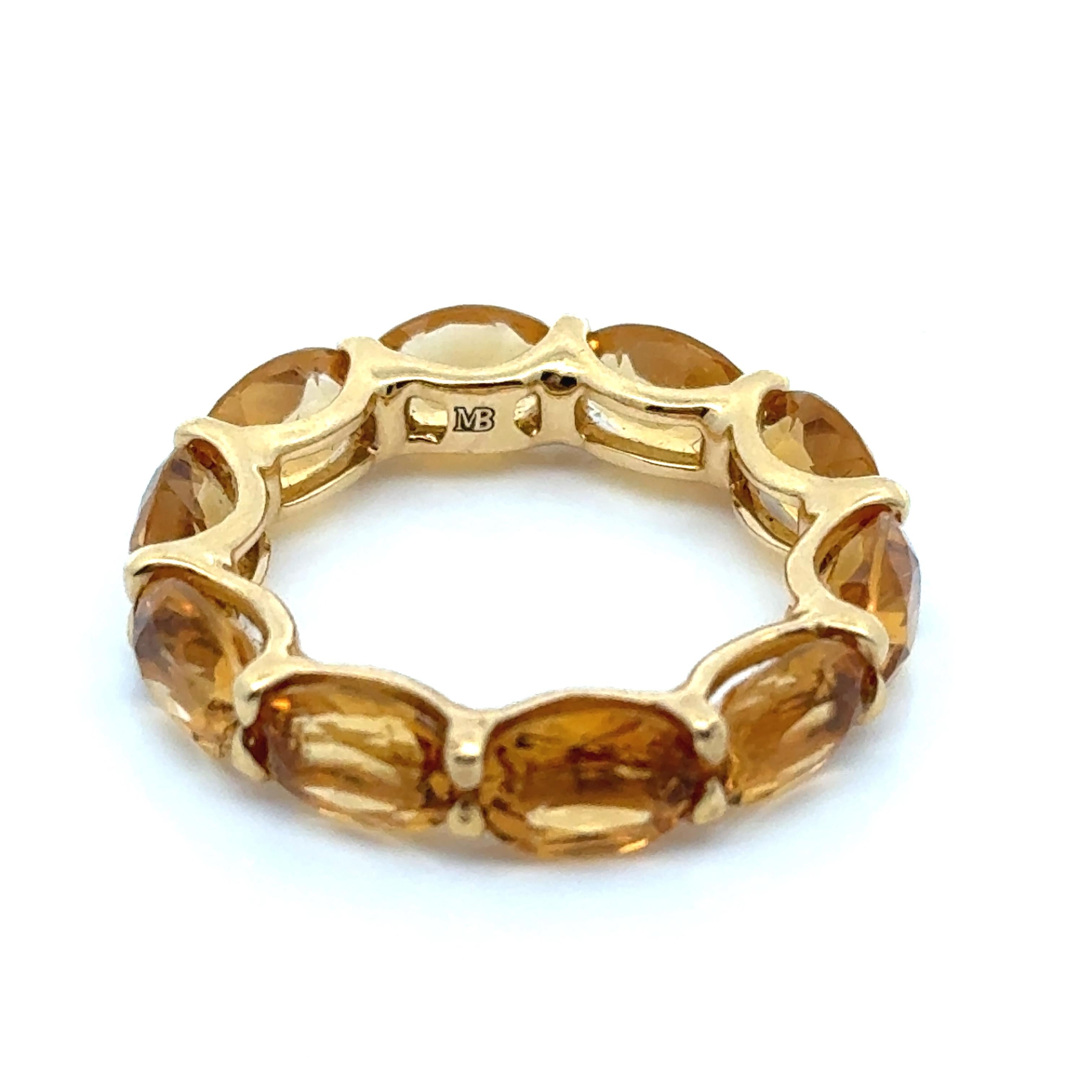 Expertly designed by Marina B, this 18K yellow gold eternity band features exquisite and unique oval citrine stones. Its timeless design ensures an everlasting bond, perfect for any occasion. Please note, this band cannot be resized, ensuring a