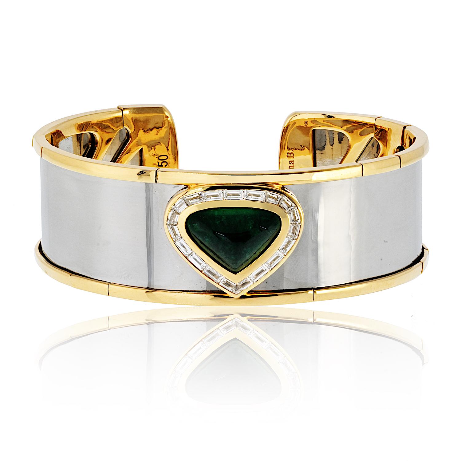 This striking Marina B. 18k Yellow Gold and Stainless Steel Cuff Bracelet showcases the brand's iconic blend of bold design and refined craftsmanship. At its center, a captivating cabochon-cut green emerald is framed by a shimmering halo of
