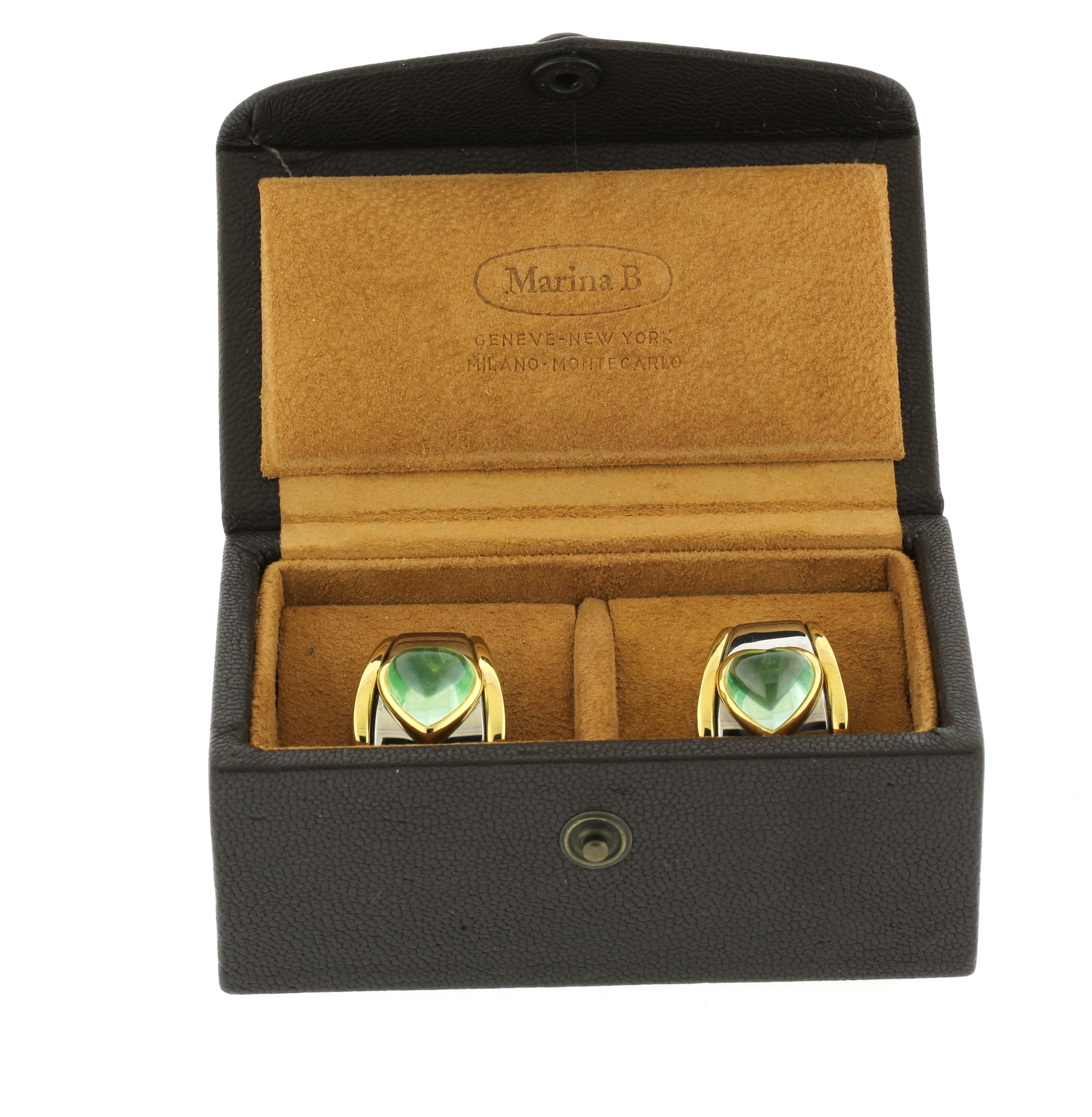 Audaci e sofisticati, questi orecchini a clip di Marina B presentano ametiste verdi incastonate in oro 18kt e acciaio. Misurano 7/8 pollici di lunghezza e si assottigliano da 12 mm a 18,5 mm, per un peso totale di 26,4 grammi. Viene fornito con la