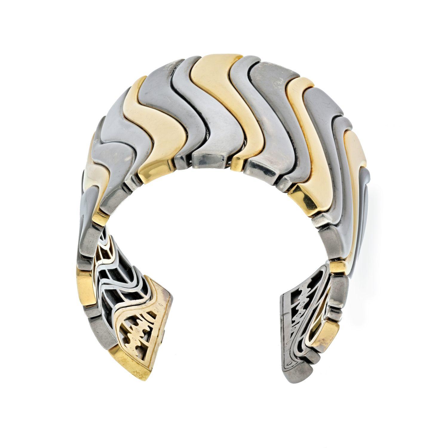 The flexible cuff-bracelet composed of contoured bands, set in alternating intervals weighing approximately 300 grams, internal circumference approximately 7.25 inches at the widest, signed Marina B.
Due to the way the cuff was designed we recommend