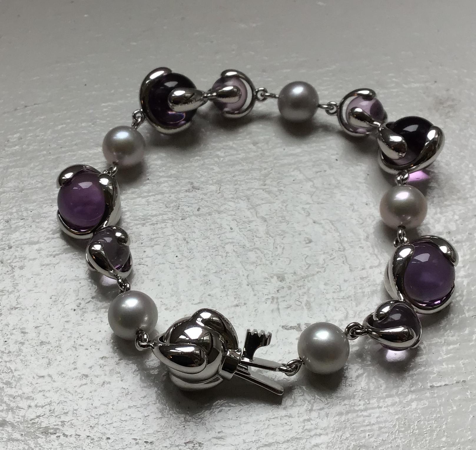 18-Karat Gold Cardan Bracelet with 35.82 ct. Amethyst Beads, and 17.20 ct. Grey Pearls with box clasp closure.

Polished 18-karat white gold hardware and frame.

Signed Marina B, Made in Italy and numbered 580059