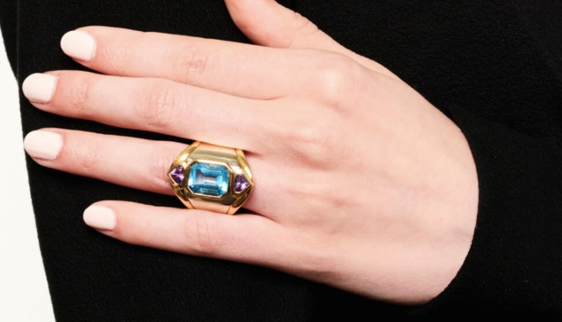 A bold Marina B Blue Topaz and Amethyst ring mounted in two-color 18k gold. 
Made in Italy, circa 1990. 

Size 6 1/2 with internal spring.