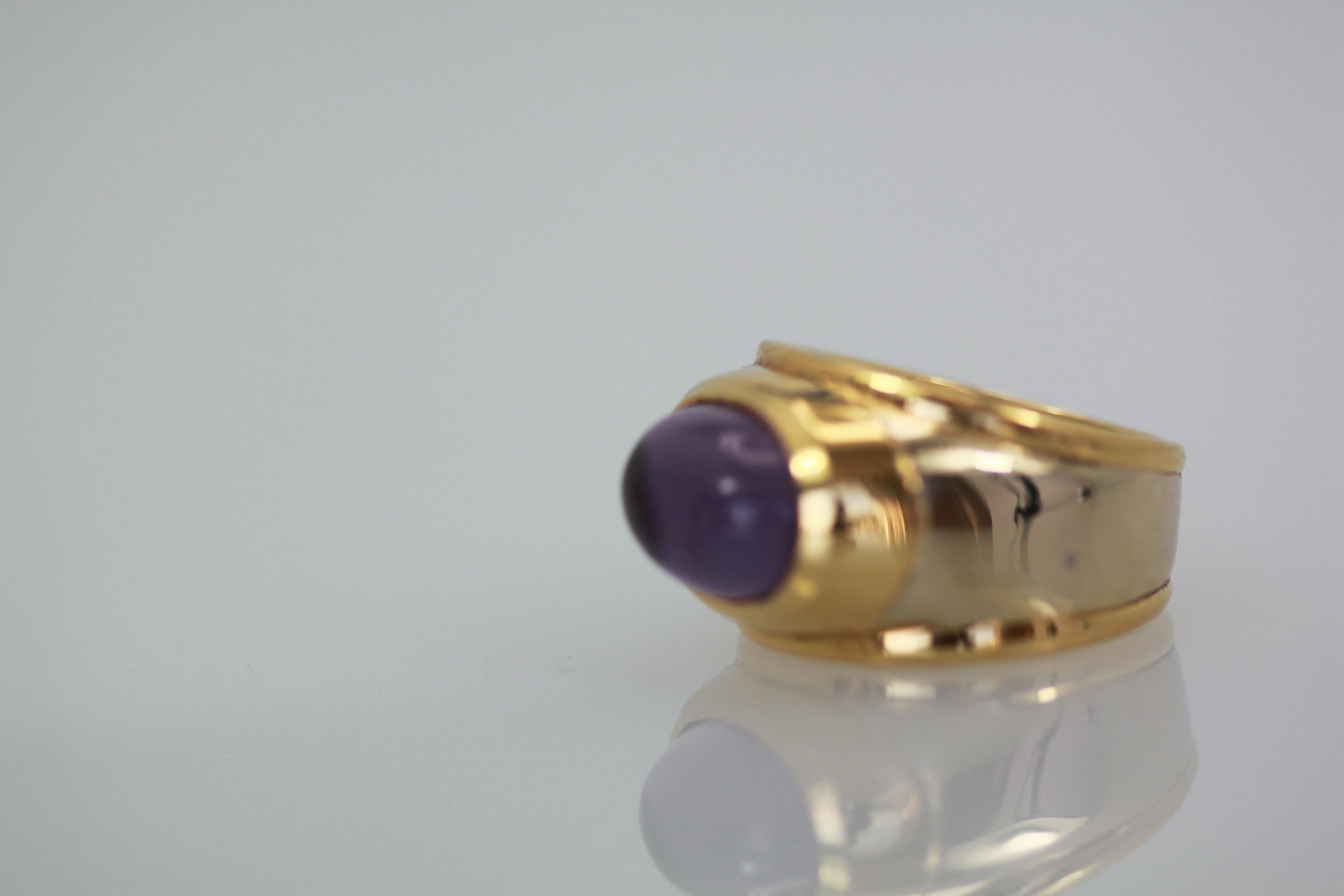 This Marina B. ring is made in 18K Yellow Gold and White Gold, it's center is a large Amethyst Cabochon.
This ring is discontinued but is just lovely.
