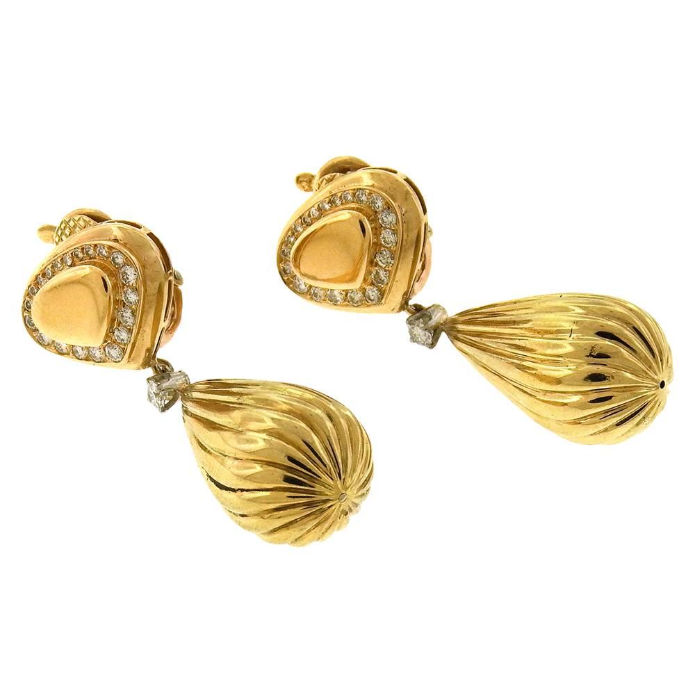 18K yellow gold Marina B. balloon drop clip-on chandelier earrings with dimaond-set heart-shape signature Marina B form, diamond set hinged and fluted pear-shape drop.  The earrings measure 5/8