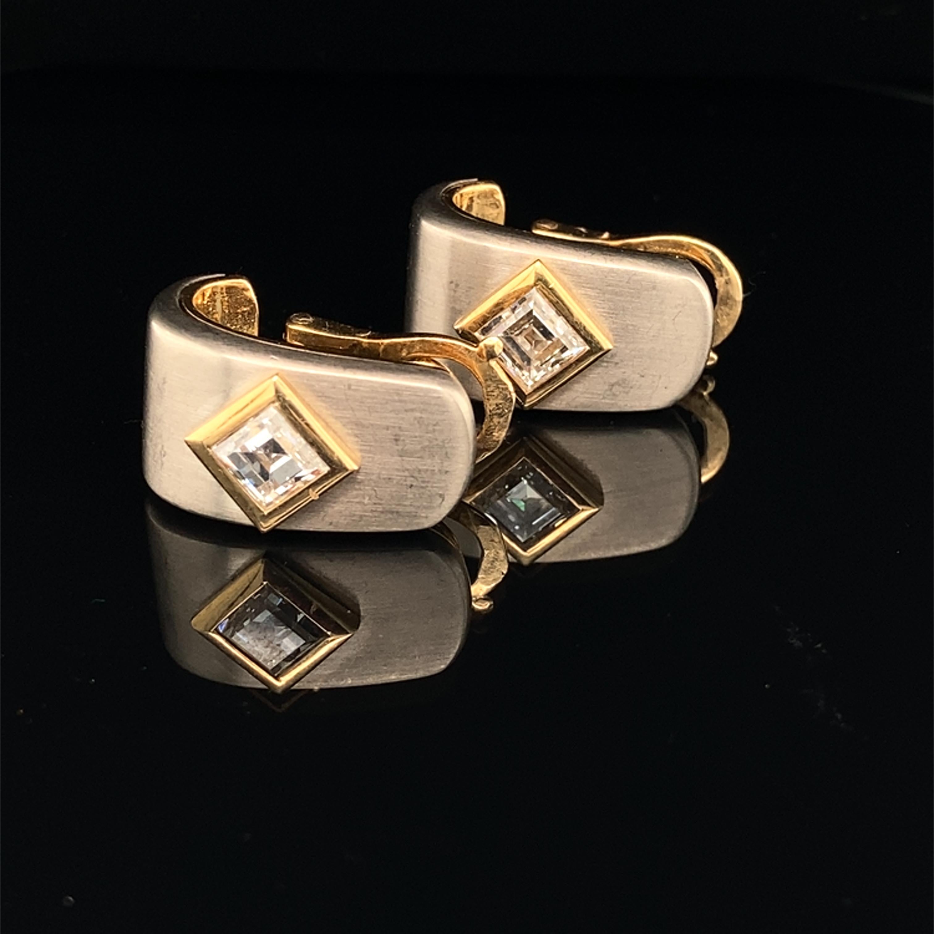 Marina B Solitaire Earrings

A fine pair of bi-colour 18K gold and diamond ear clips by Marina B, 
the brushed white gold clip centred by a square-shaped diamond, approximately 1 carat each, DEF, VS/S, framed in polished yellow gold.

With French