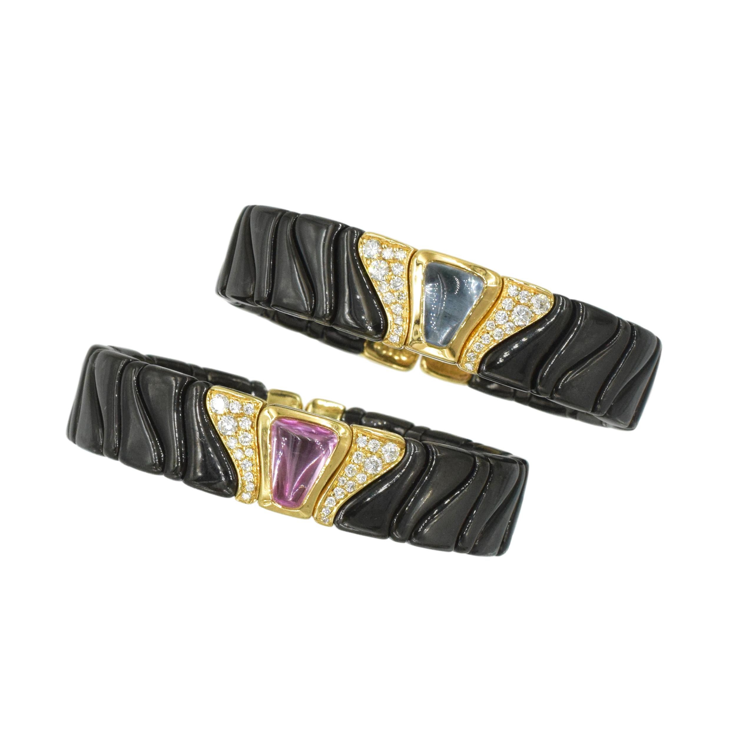 Set of two Marina B Black and yellow gold cuff braceletts with diamond and topaz accents. 
These flexible bracelets consist of multiple black gold links mounted on a steel spring. Centerpieces of the bracelets feature three yellow gold links, center